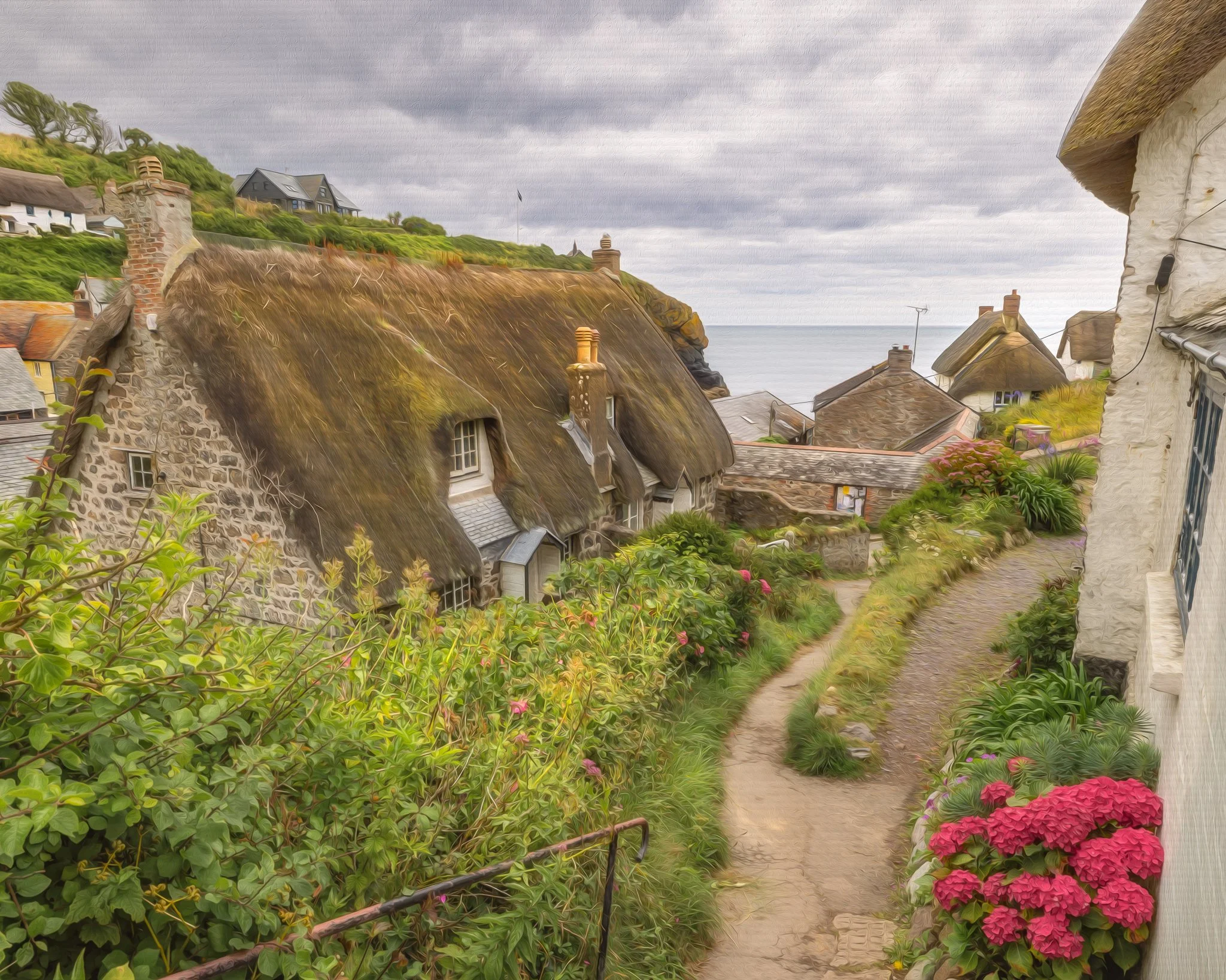 Traditional thatched cottage at Cadgwith Cove on The Lizard Peninsula, Cornwall, near the harbour path.