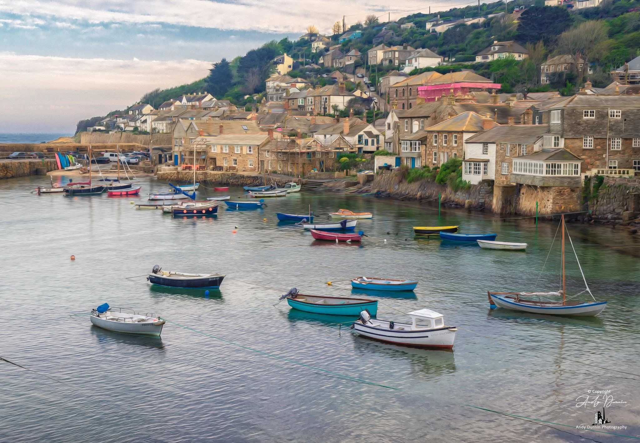 This Mousehole Harbour print features colourful fishing boats, calm water and traditional village buildings in one of Cornwall’s most iconic harbour settings. Finished in a painterly fine art style, this Cornwall coastal wall art print celebrates the
