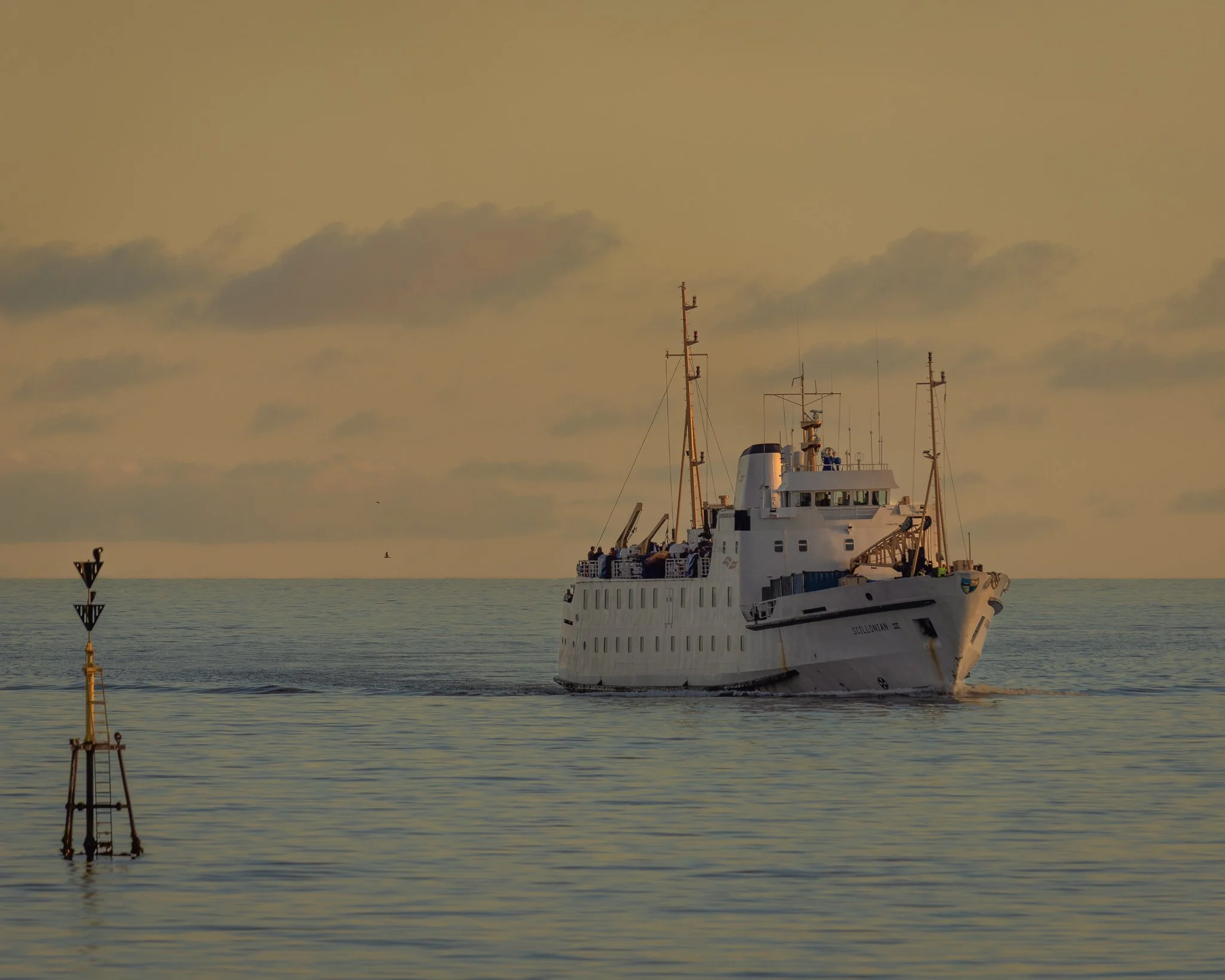The Scillonian III returning across Mount’s Bay towards Penzance, with the coastline of West Cornwall in the background.