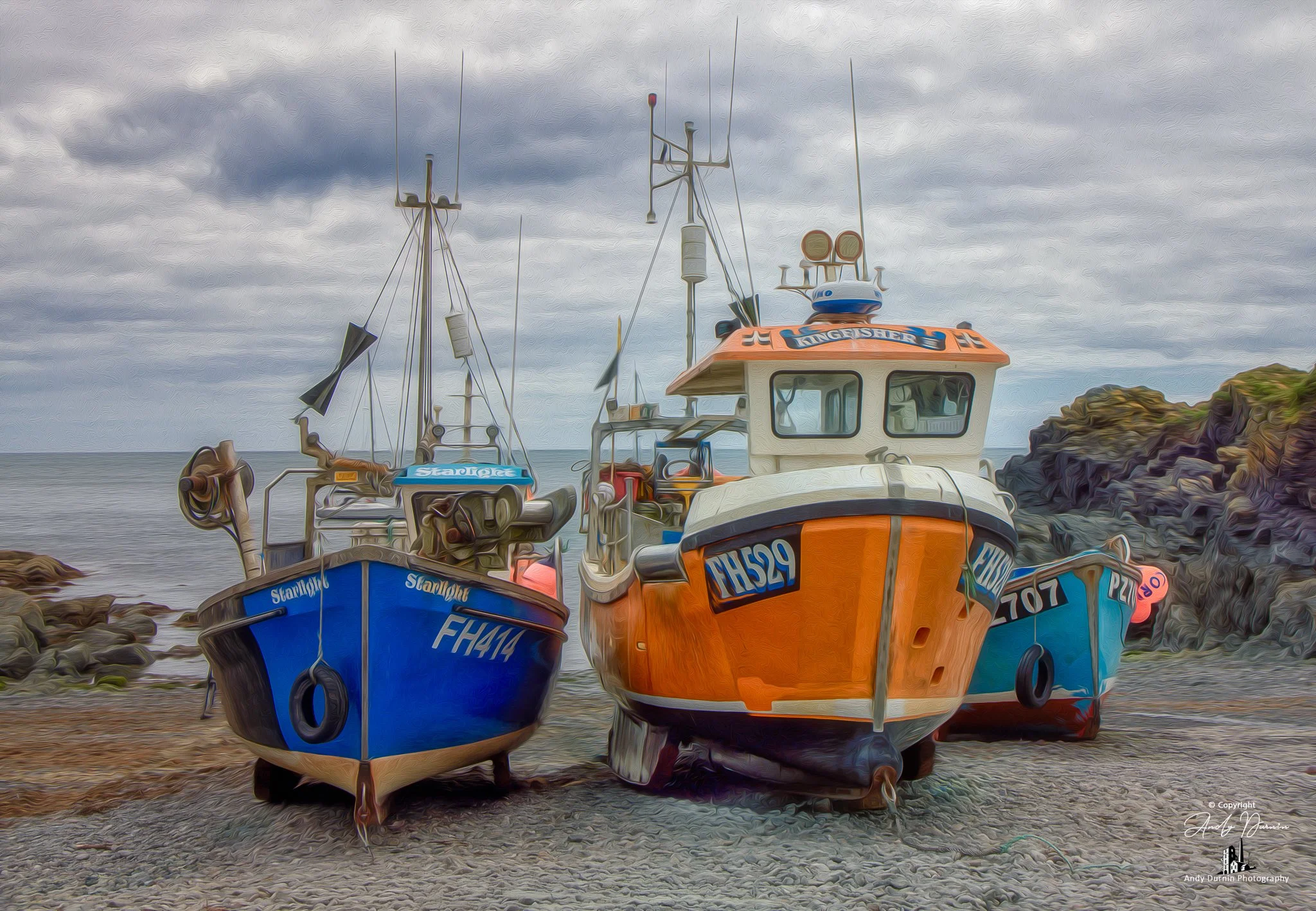 Fishing Boats at Cadgwith Cove
A striking fine art photograph of fishing boats at Cadgwith Cove, resting on the shingle between dark rocks and the open sea. Full of colour, texture, and traditional Cornish character, this coastal print captures the t