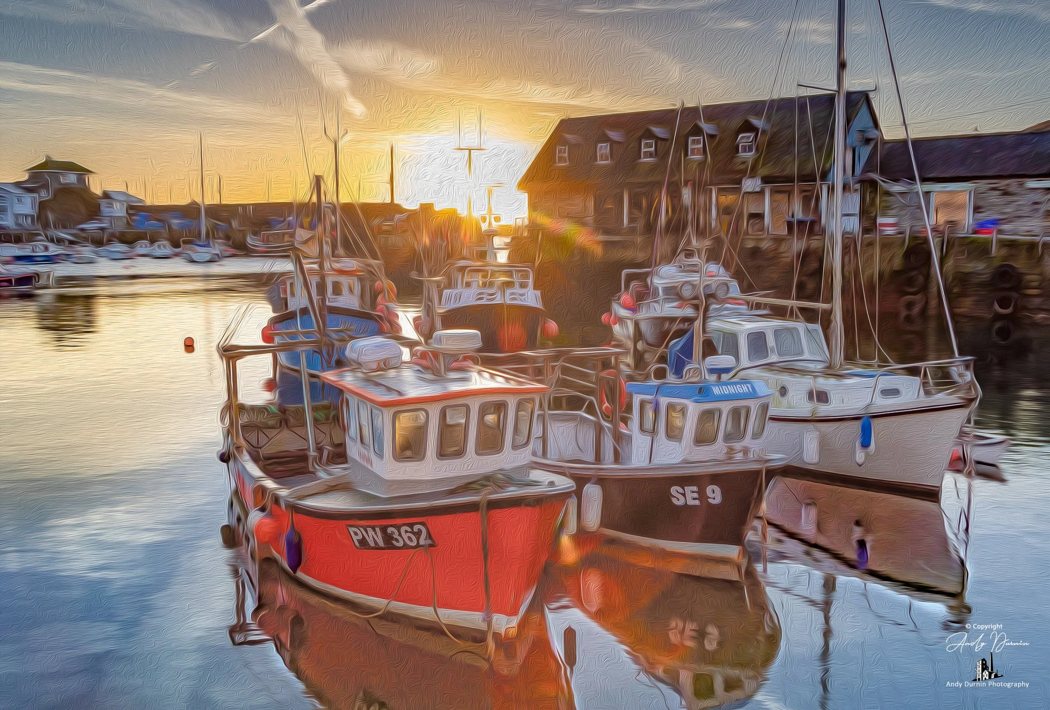 Rising Sun at Mevagissey Harbour
A fine art photograph of the rising sun at Mevagissey Harbour, where golden morning light falls across colourful boats and still water. Full of warmth, reflection, and coastal character, this Cornish harbour print cel