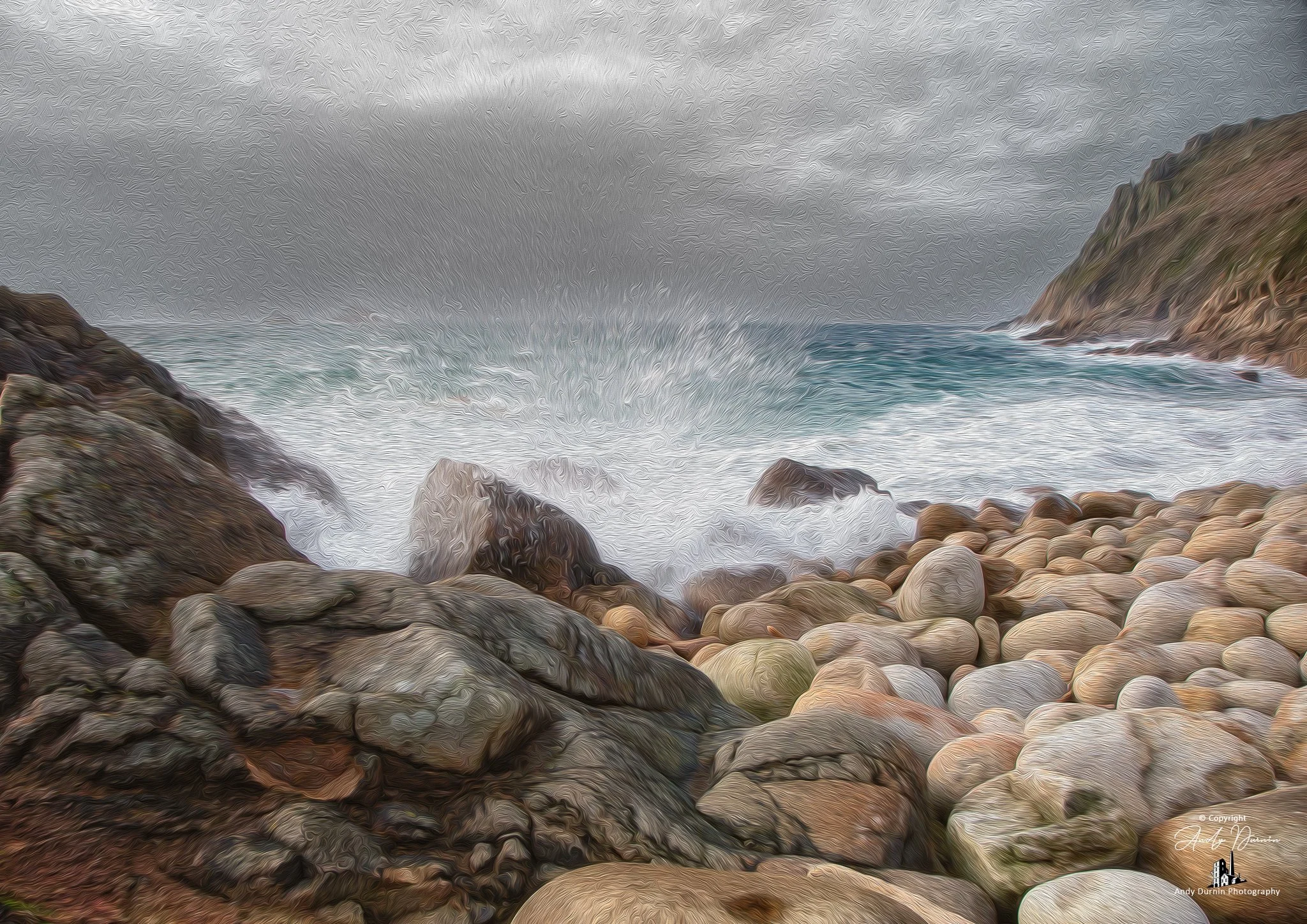 Porth Nanven (The Cot Valley).  Stormy seascape with rocky shore and crashing waves, grey sky, and distant cliffs.