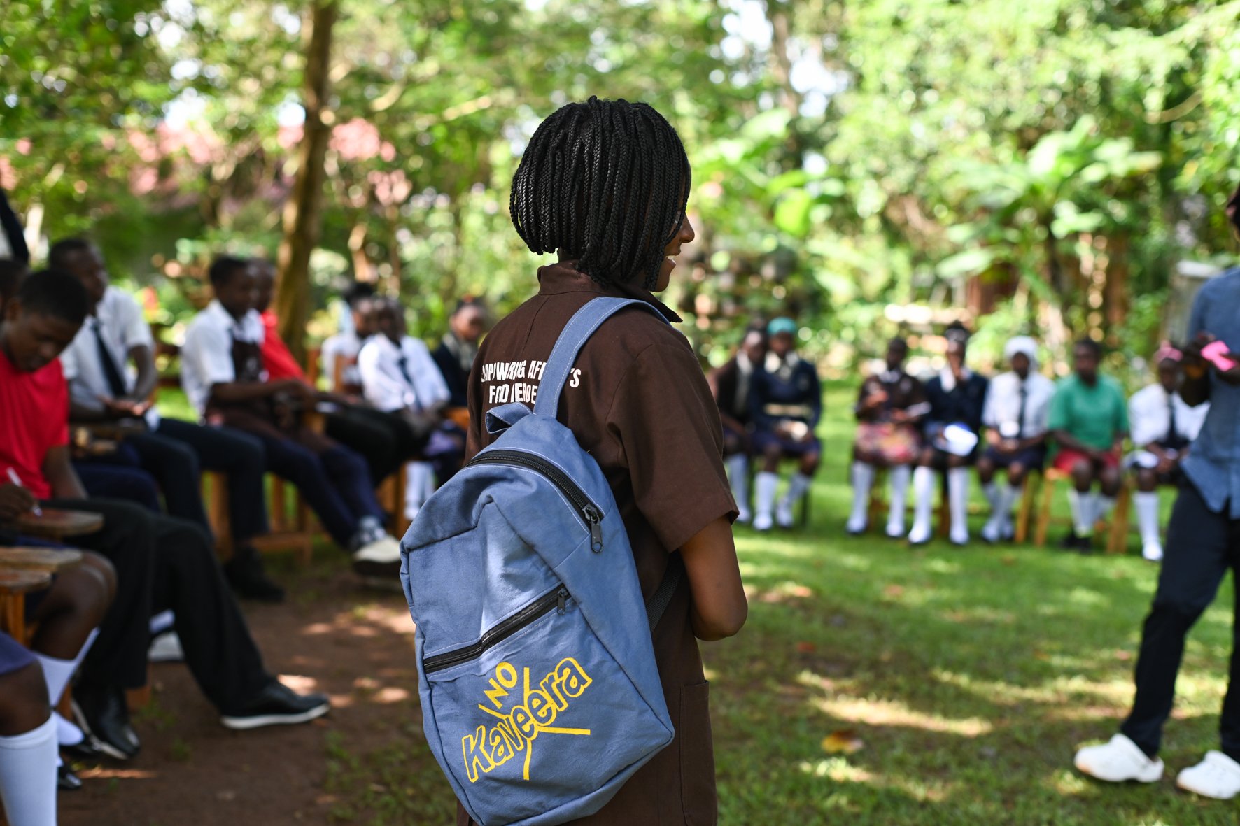 I student carrying a body and soil no waste school bag