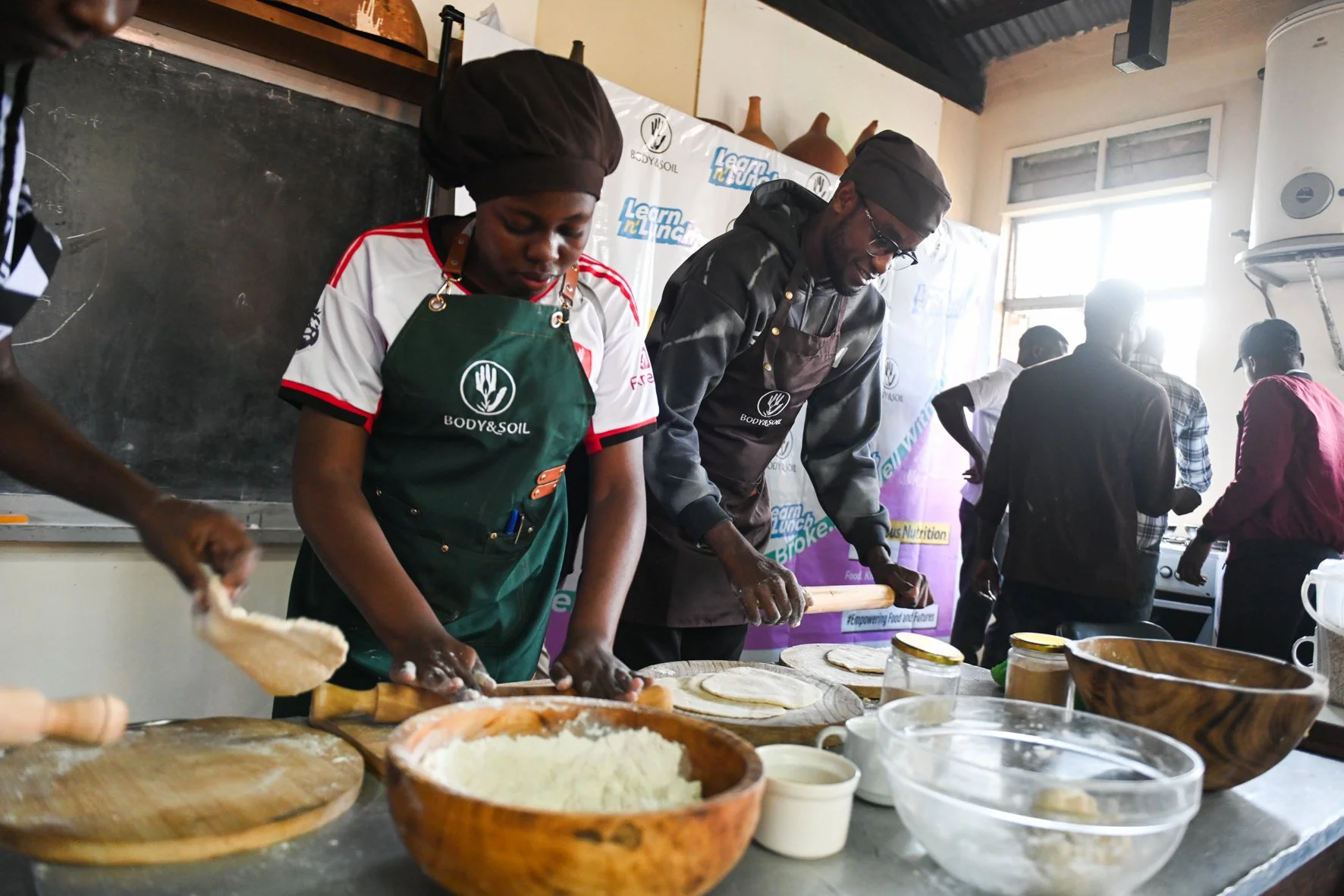 Students at kyambogo university learning how to make bean bread