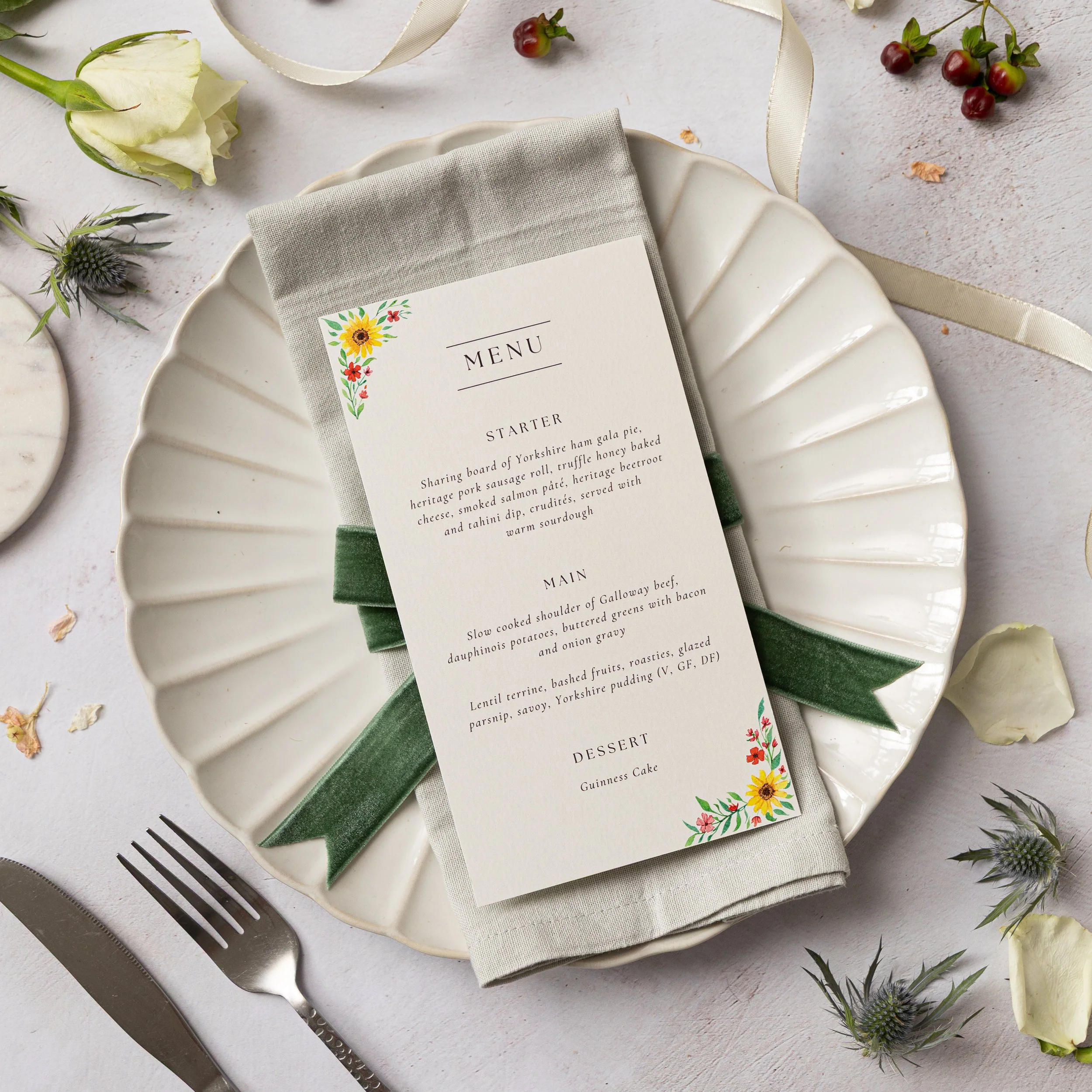 A wedding menu with a handpainted design in a summer theme