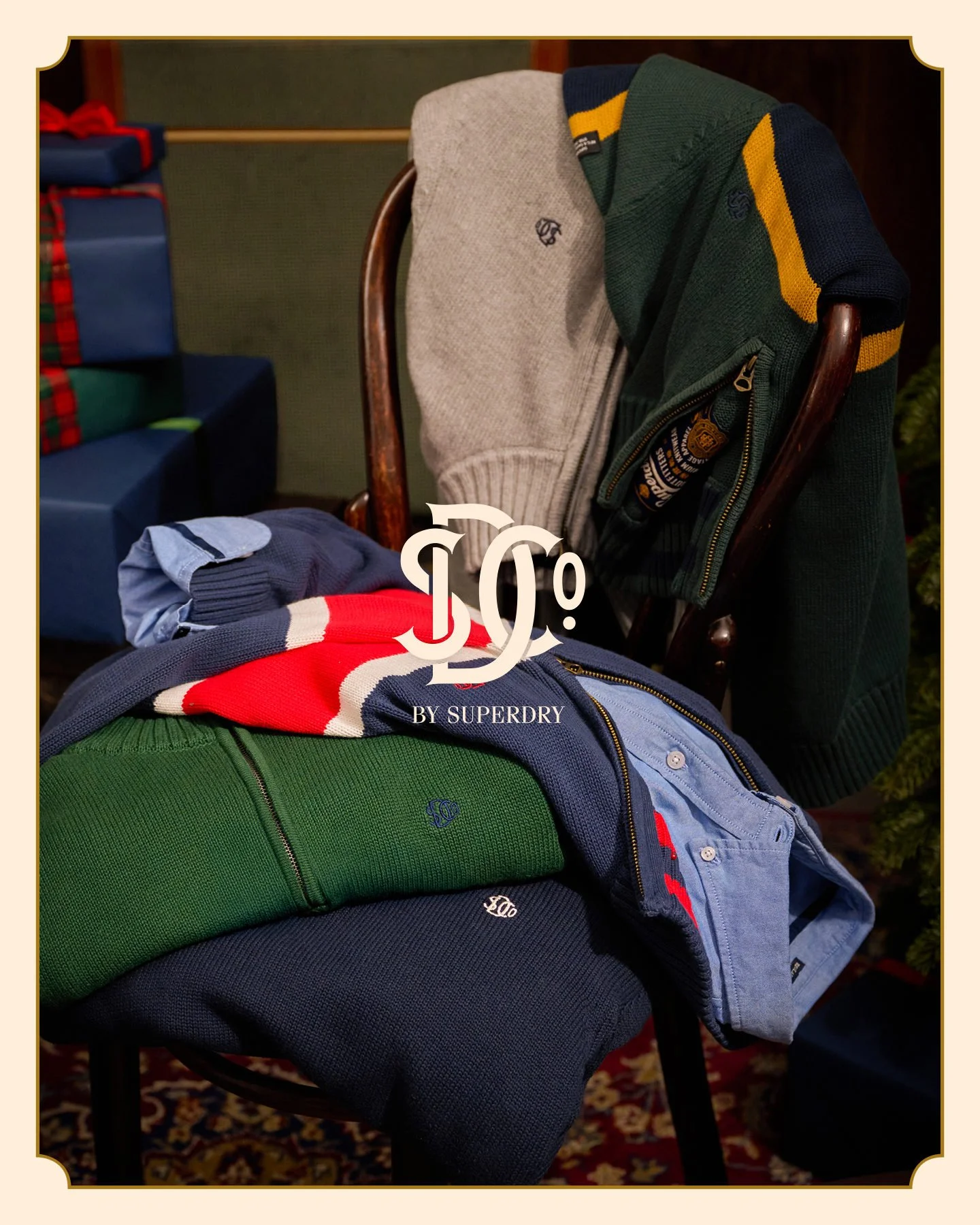 Superdry jumpers and shirts on a chair for the Christmas 25 campaign