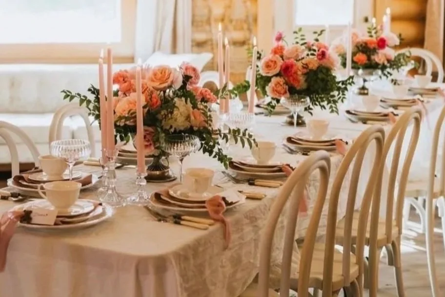 Elegant reception table setup for an intimate Alaska elopement, featuring warm tones, floral arrangements, and refined place settings.