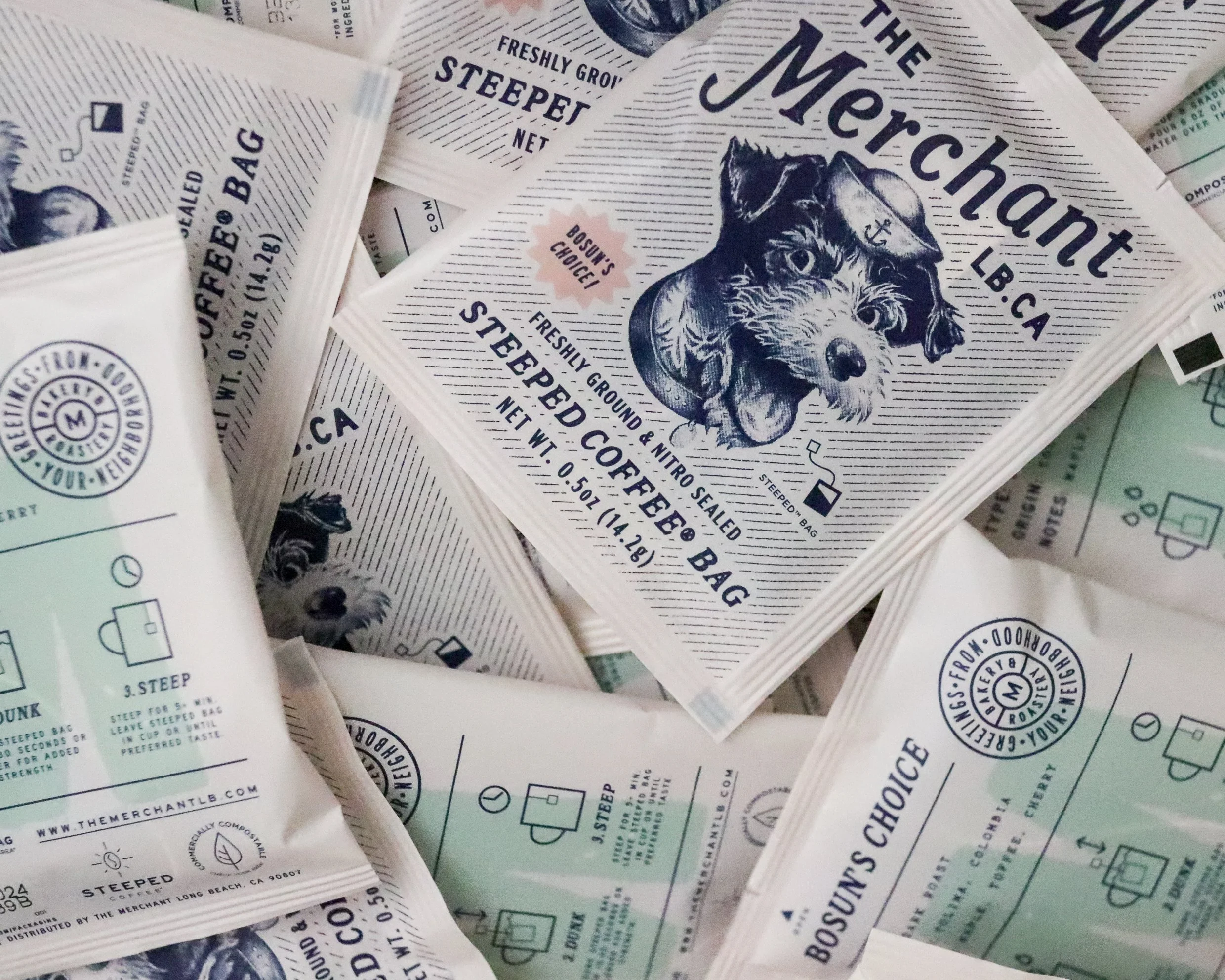 Merchant steeped coffee bags with a dog in a sailor hat on the wrapper