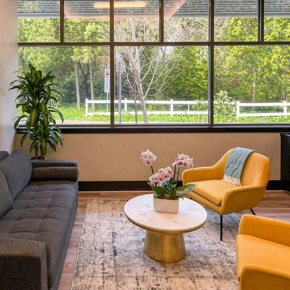 Comfortable teen therapy lounge at Guide Behavioral Health with natural light and seating for relaxation and conversation