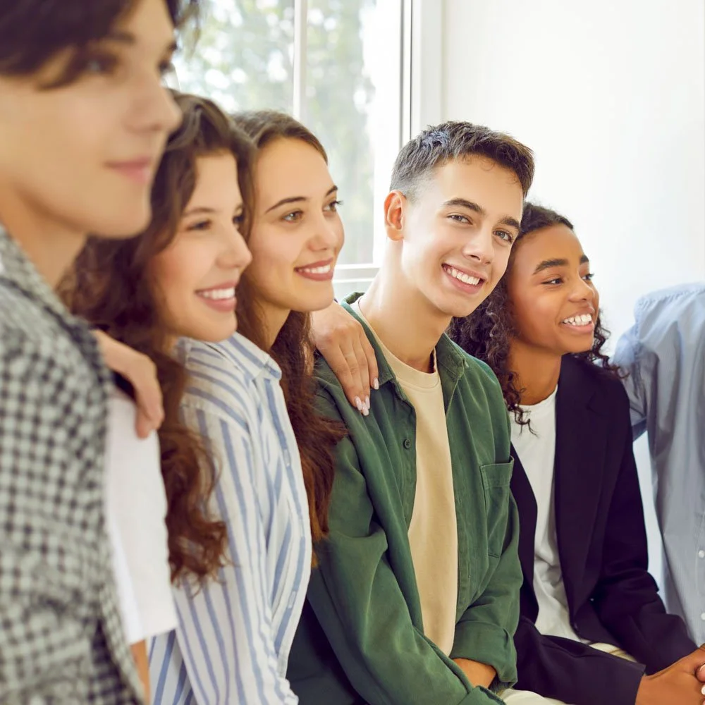 Teens sitting together during a supportive group therapy session at our Menlo Park teen mental health center.