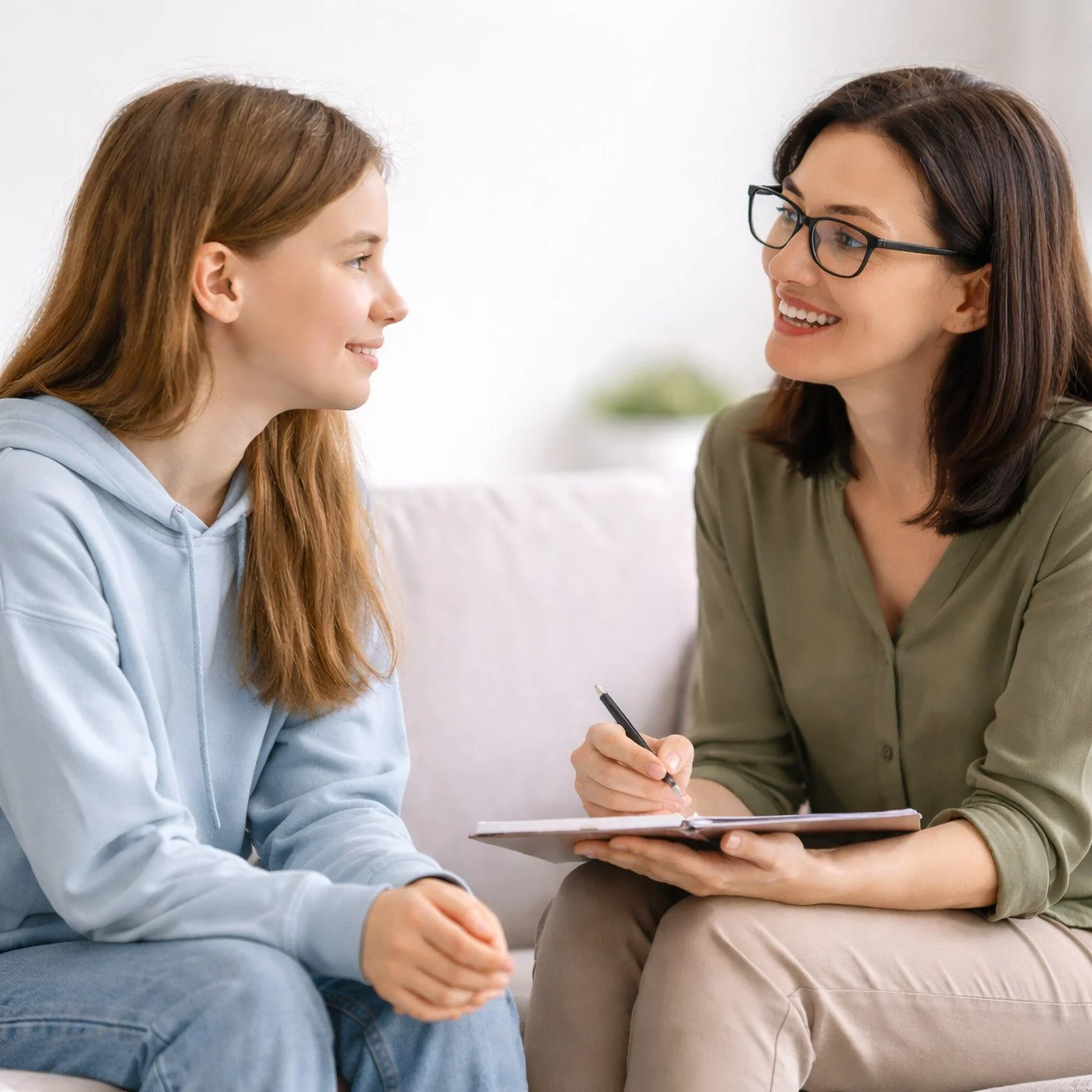 Teen speaking with therapist during initial mental health consultation in Menlo Park