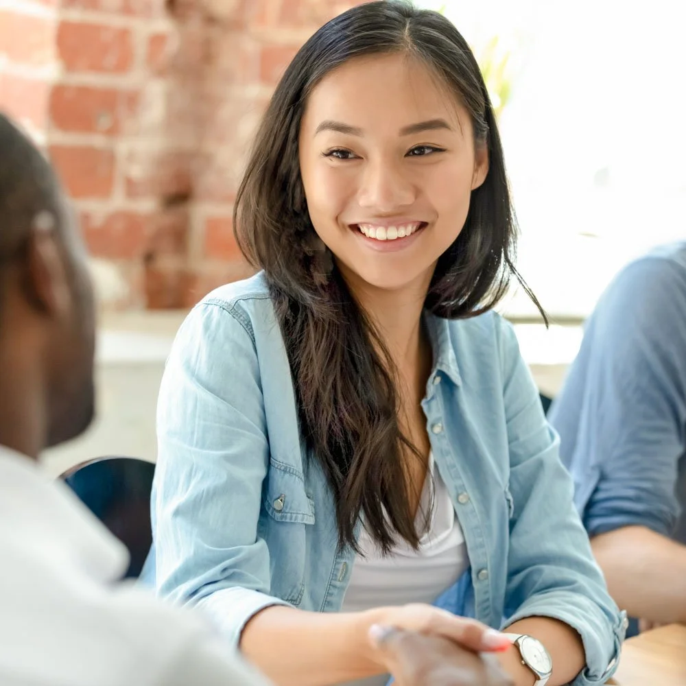 Teen in after-school therapy session with clinician at mental health program in Menlo Park