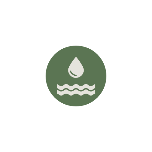 Water droplet falling into wavy water within a green circle