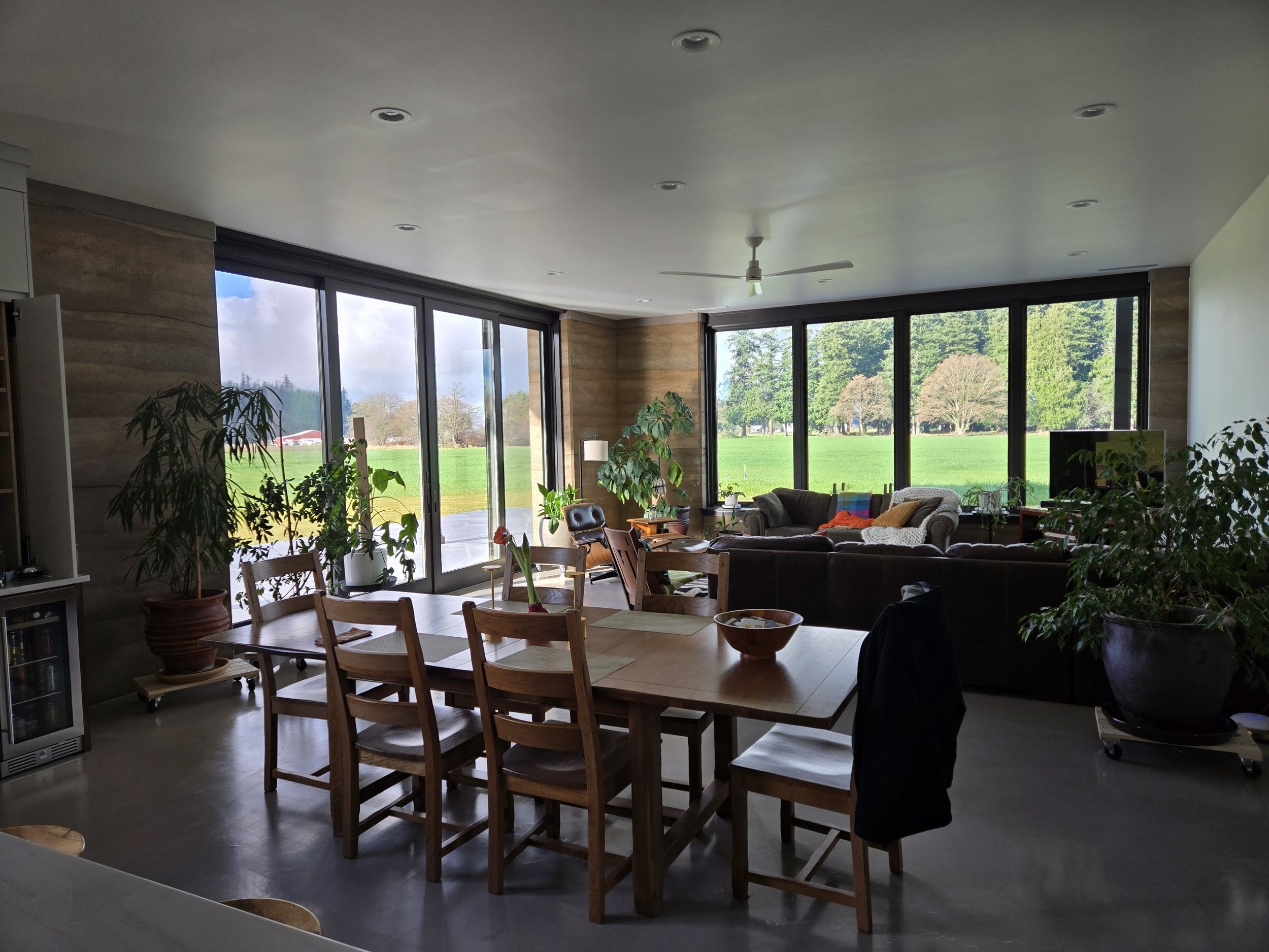 Highly insulated rammed earth walls