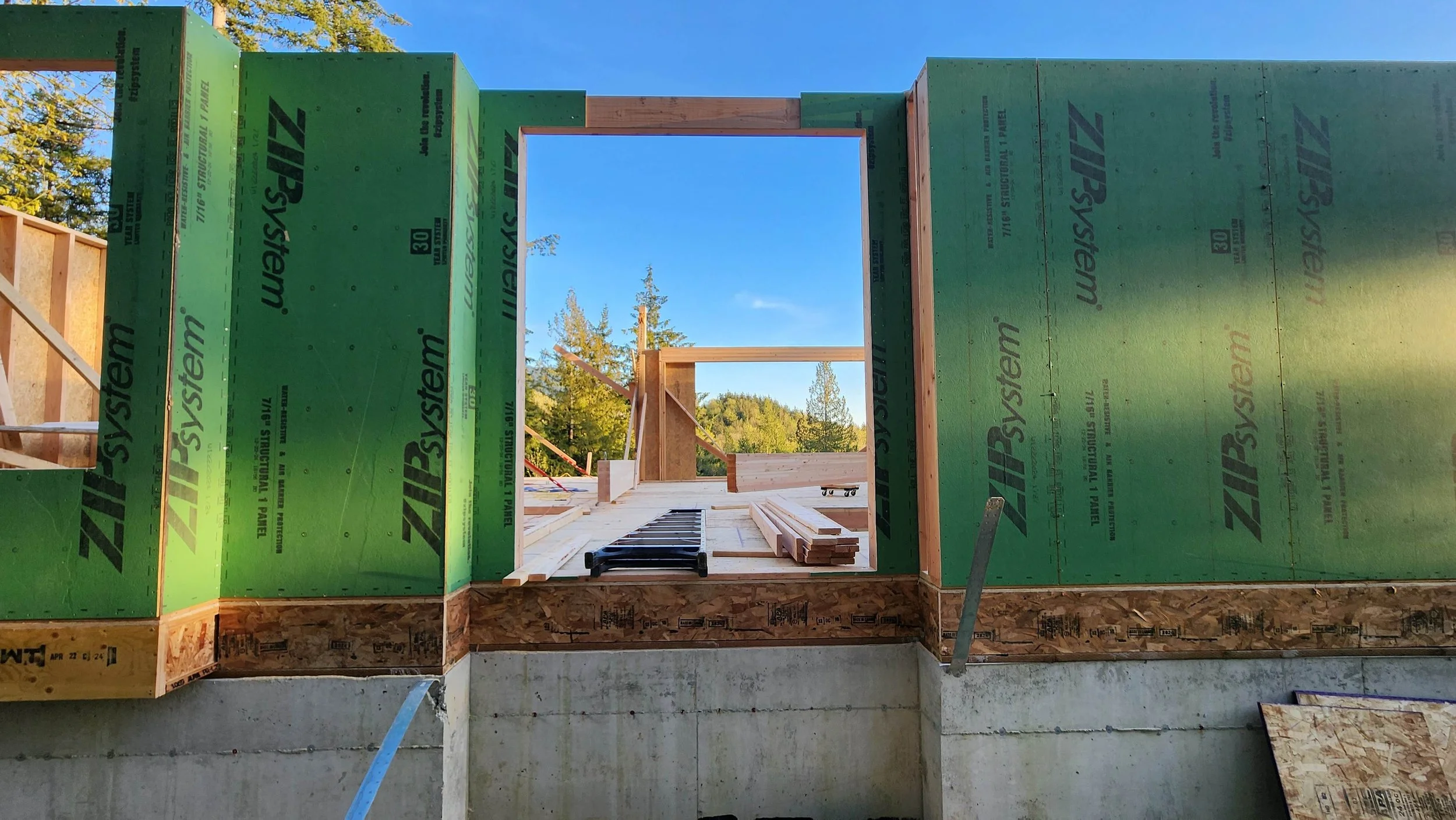 The first floor of a new house partially framed with exposed studs
