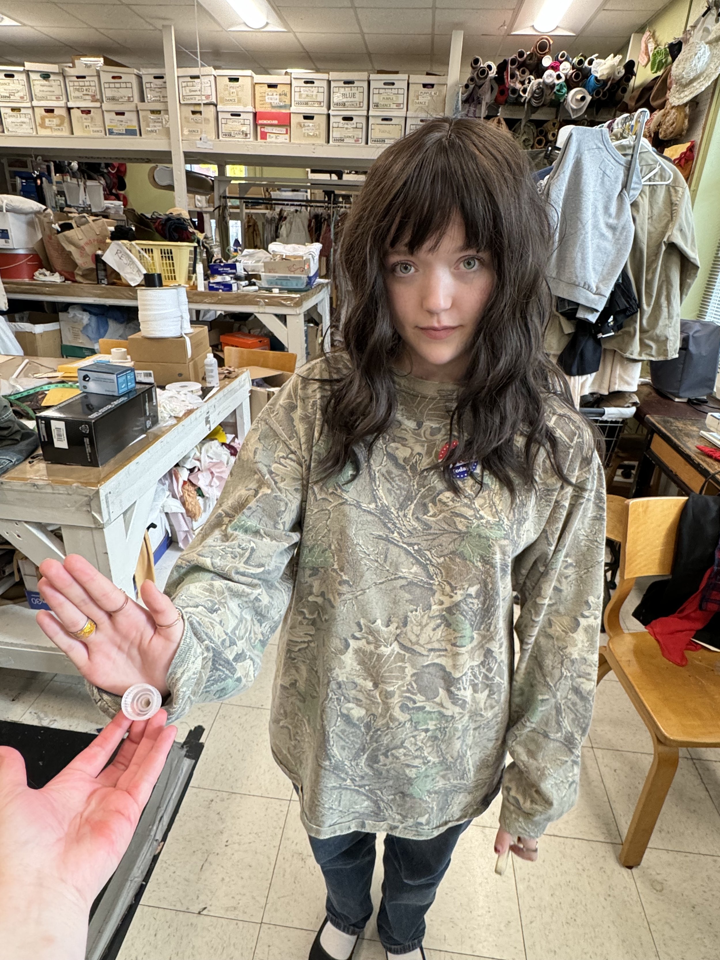 Actress wearing full rigging set up underneath her wig.