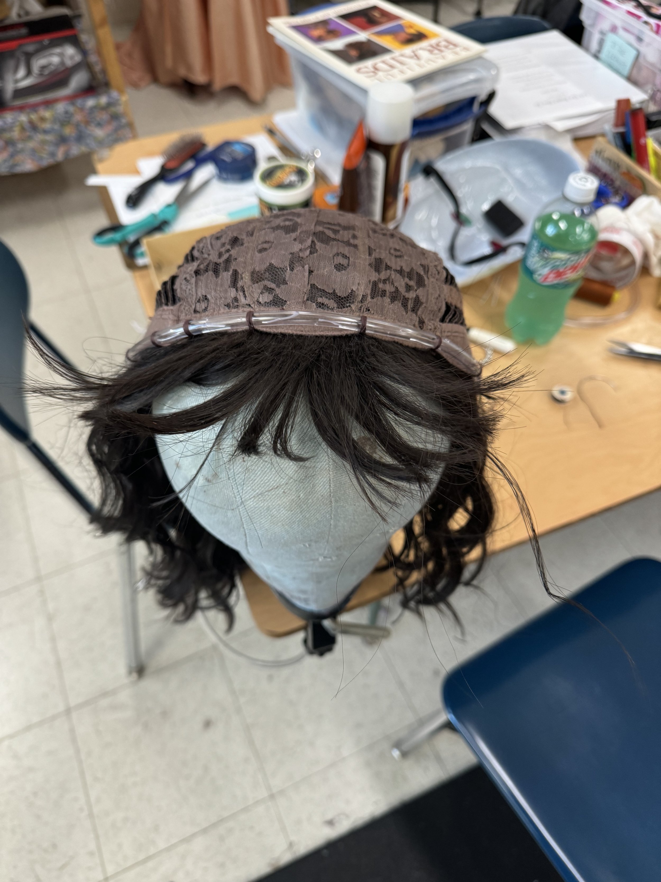 The wig turned inside out and tacked in place.