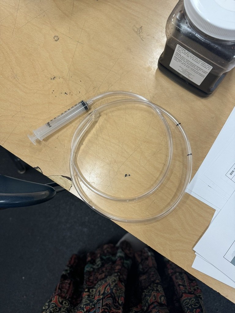 Attempt to seal the tubing with a syringe.