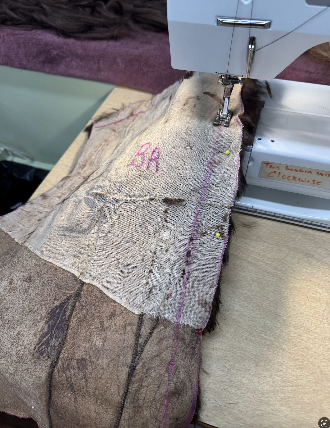 Initial sewing on the fur with a leather needle.