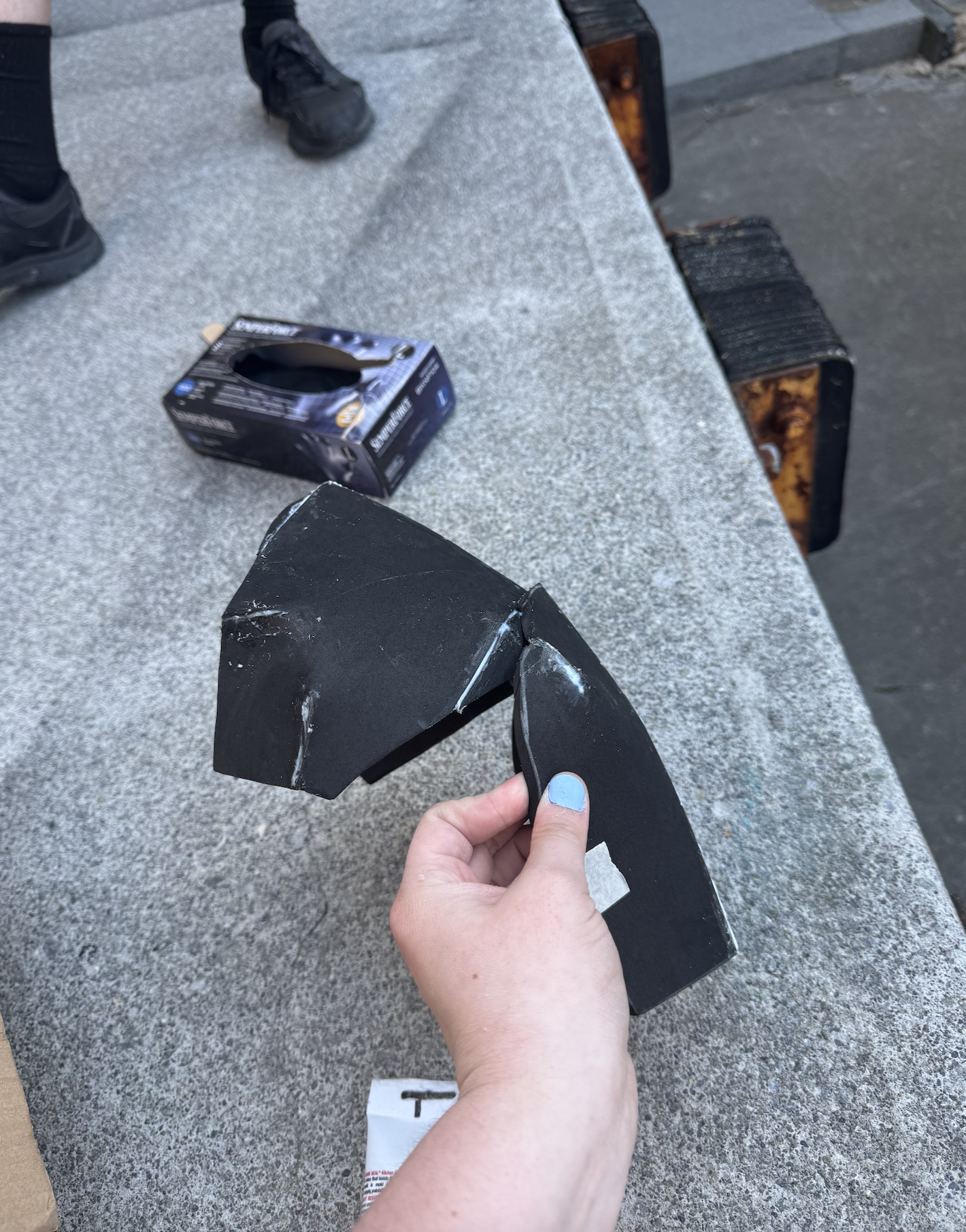 Caulking the gaps on the shoulder plate for stability, front view.