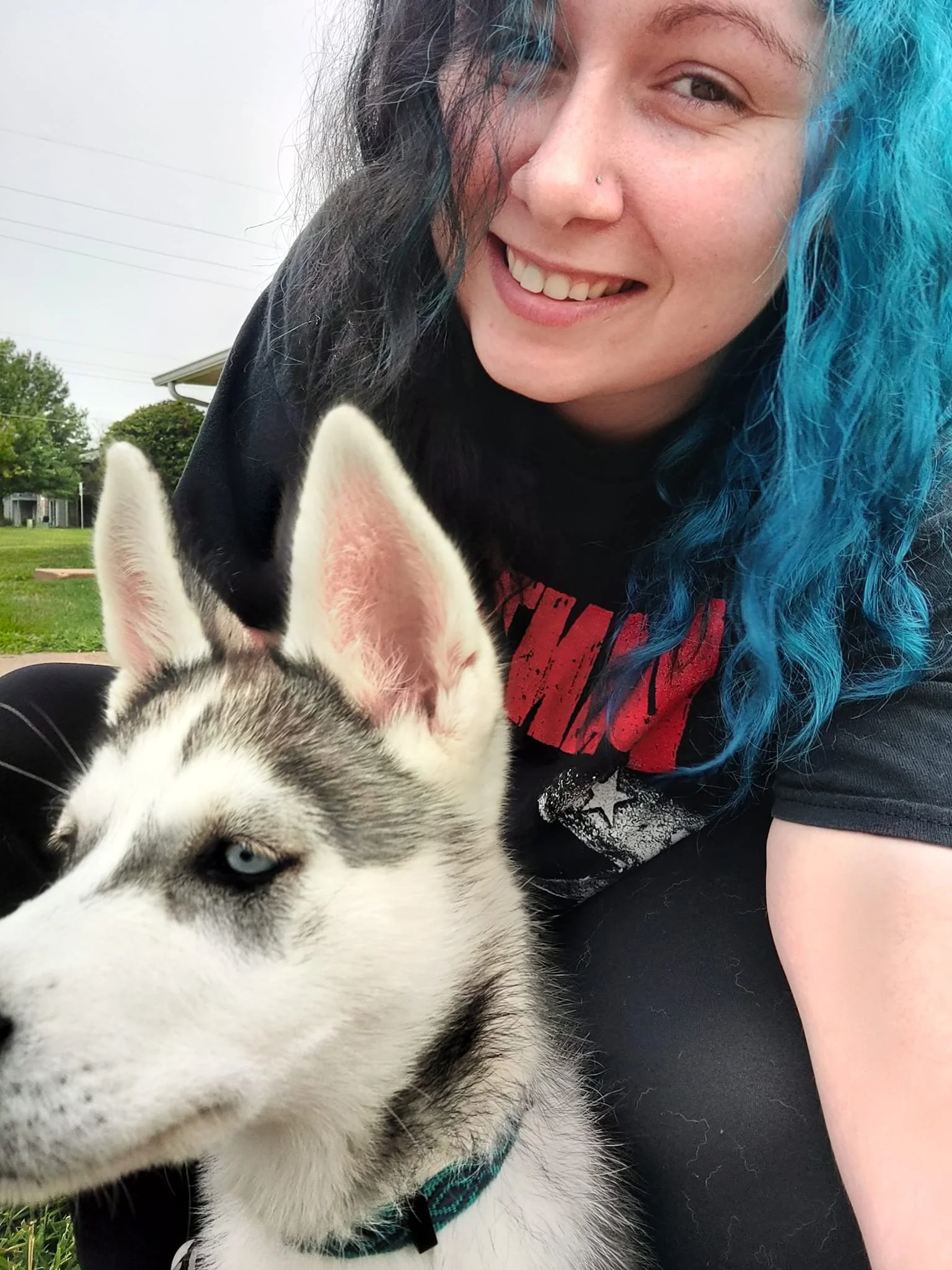Portrait of Shayna, a Licensed Master-Level Psychologist in Kansas, with her dog, providing neurodivergent-affirming and nerd-friendly online therapy.