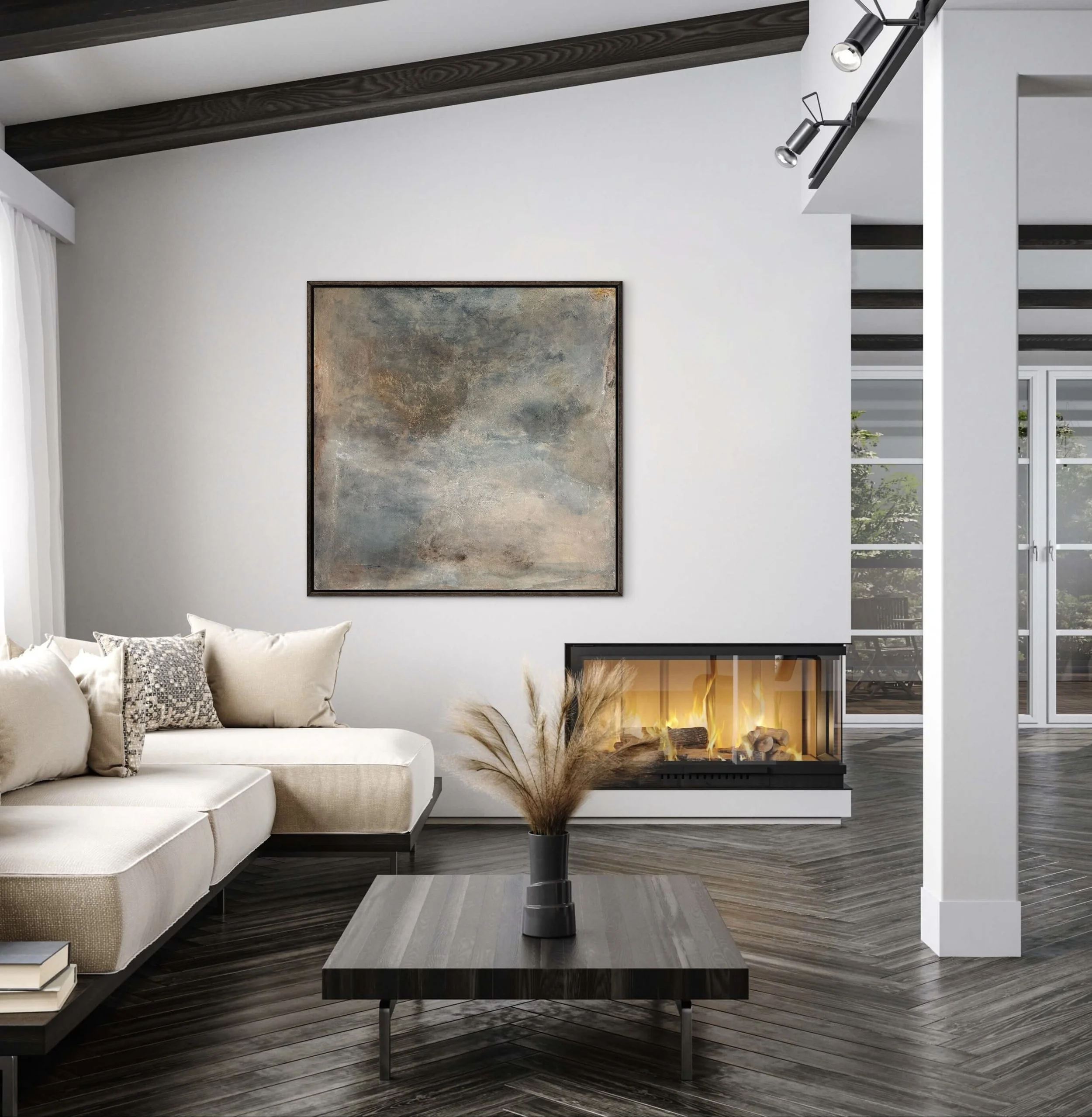 Framed abstract painting with atmospheric layers of blue-gray, taupe, cream, and warm ochre, hanging above a sleek fireplace in a refined modern living room with dark herringbone floors, neutral furnishings, and natural light.