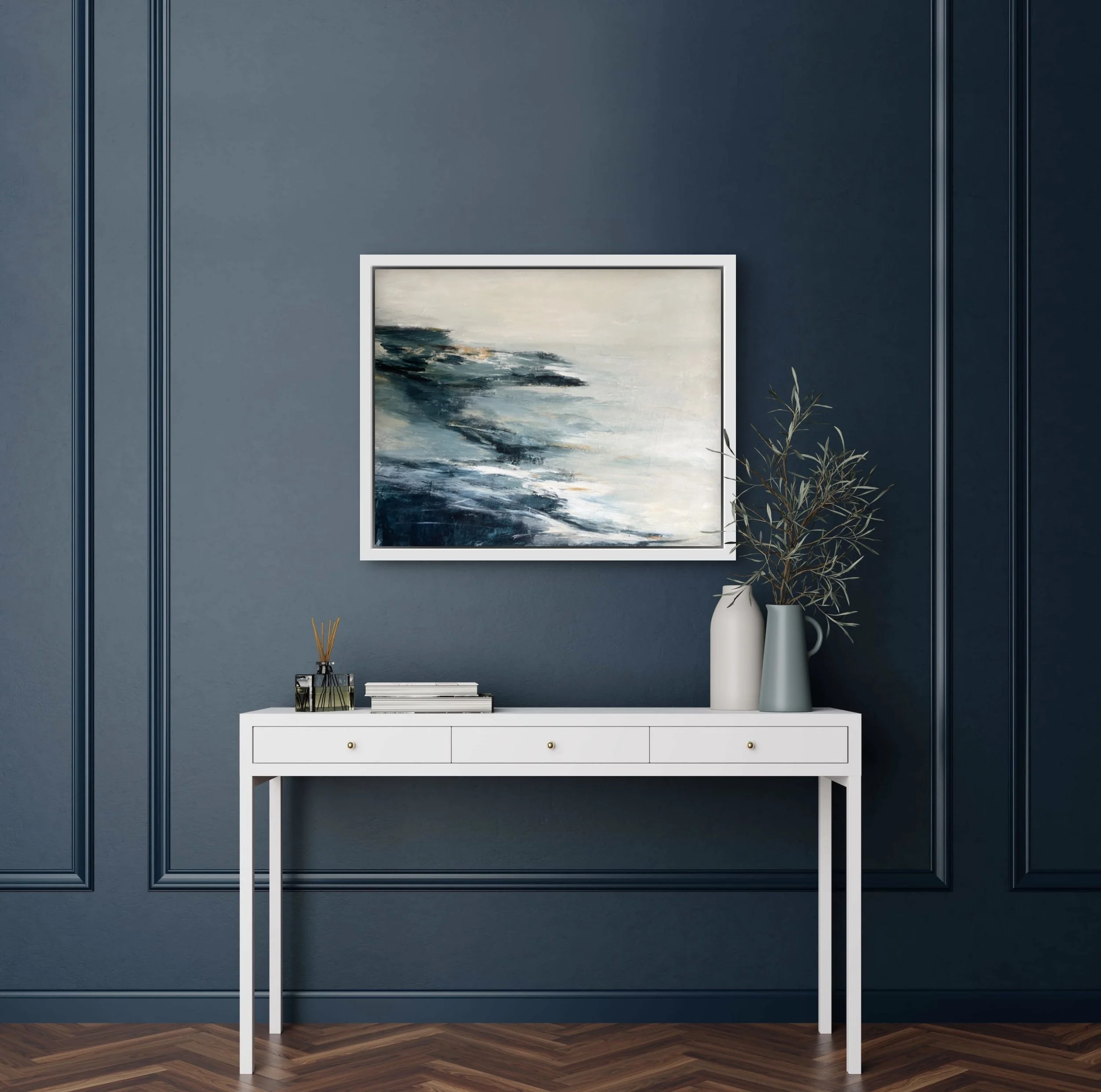 Abstract seascape Coastal Dreams in a white frame, displayed in a light-filled entryway, bringing calming ocean-inspired tones to welcome guests.
