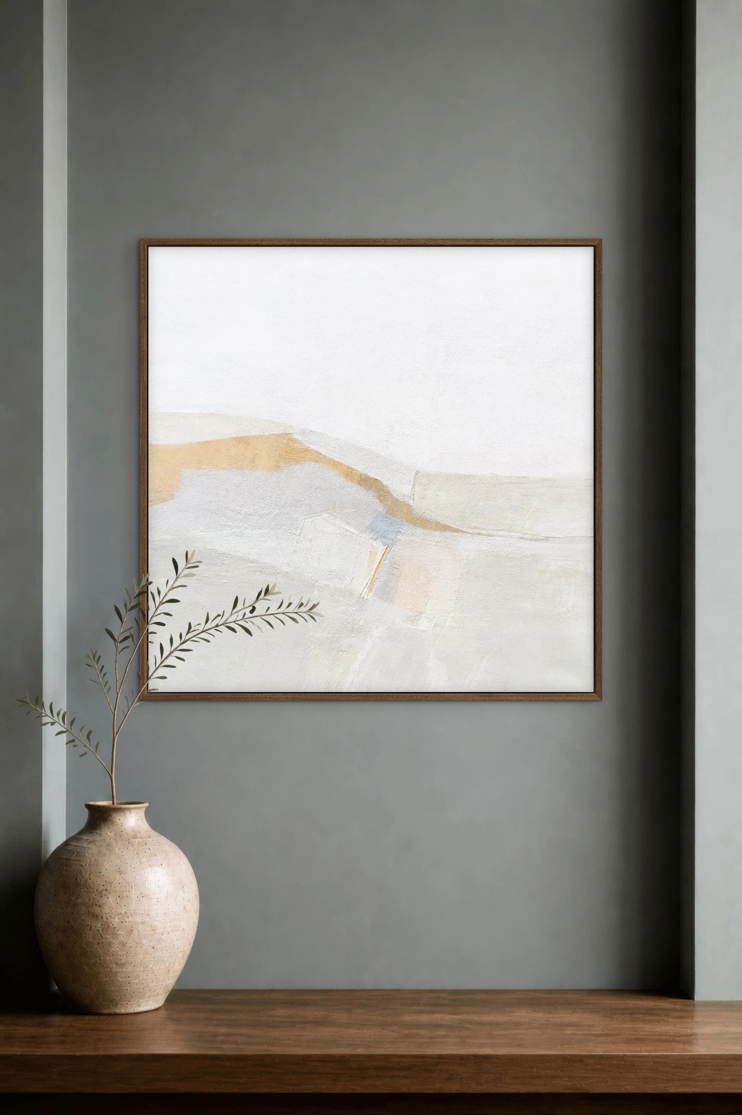 Slow Mornings abstract fine art print by Melanie Biehle, shown framed in a refined interior with warm neutral tones, soft landscape-inspired forms, and a ceramic vase.
