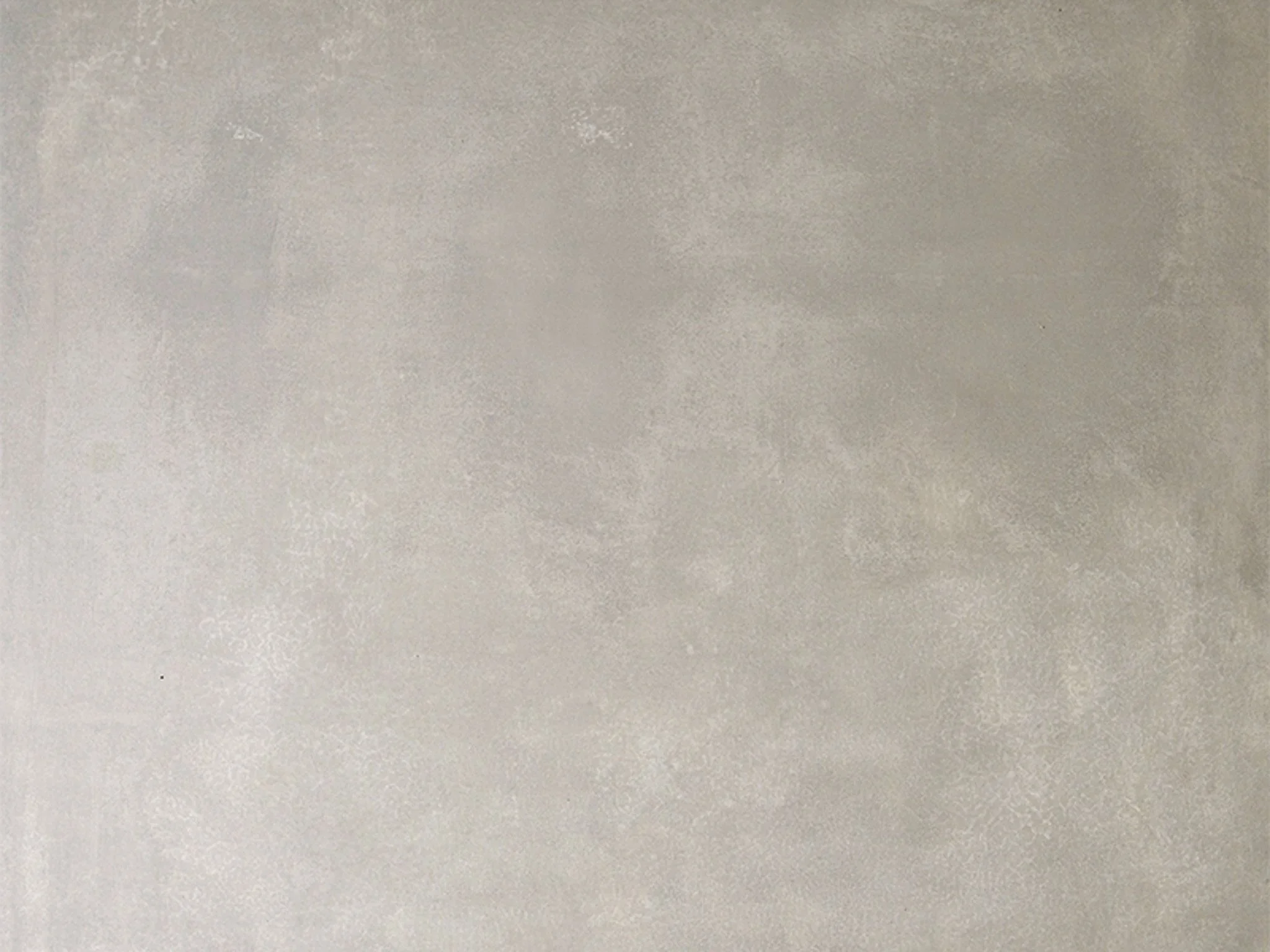 Close-up of a smooth, beige textured surface.