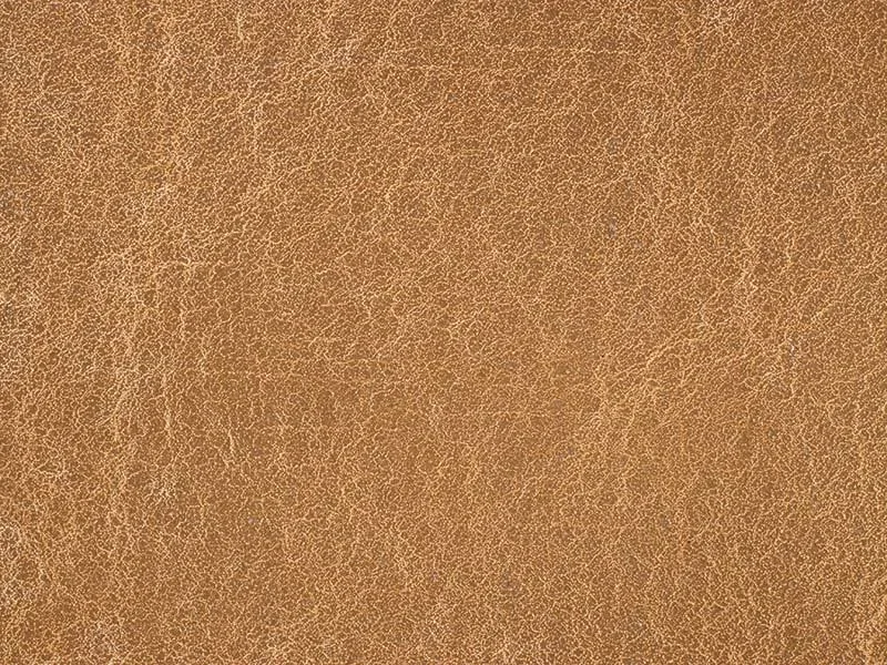 Close-up of a textured leather surface in brown color.