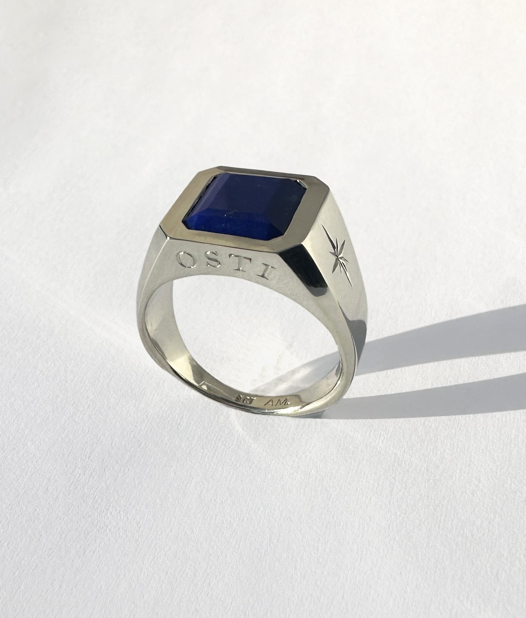 Engraved with the family name Osti in Cyrillic, handwritten by Grandpa in Serbia
Made in white gold and set with an epic Lapis Lazuli.