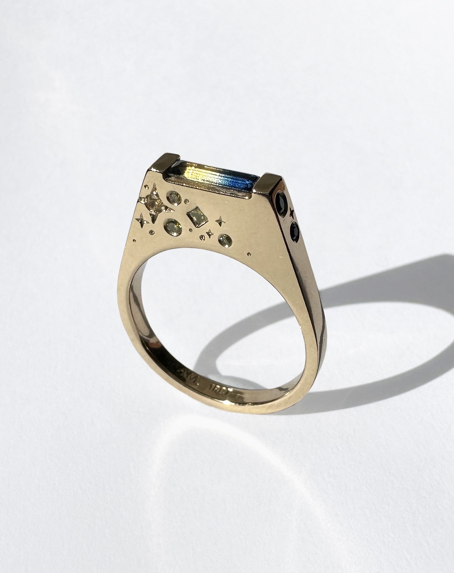 Parti sapphires, ethically fossicked and flanked by a spray of diamond and sapphire stars, all set in 18k gold.