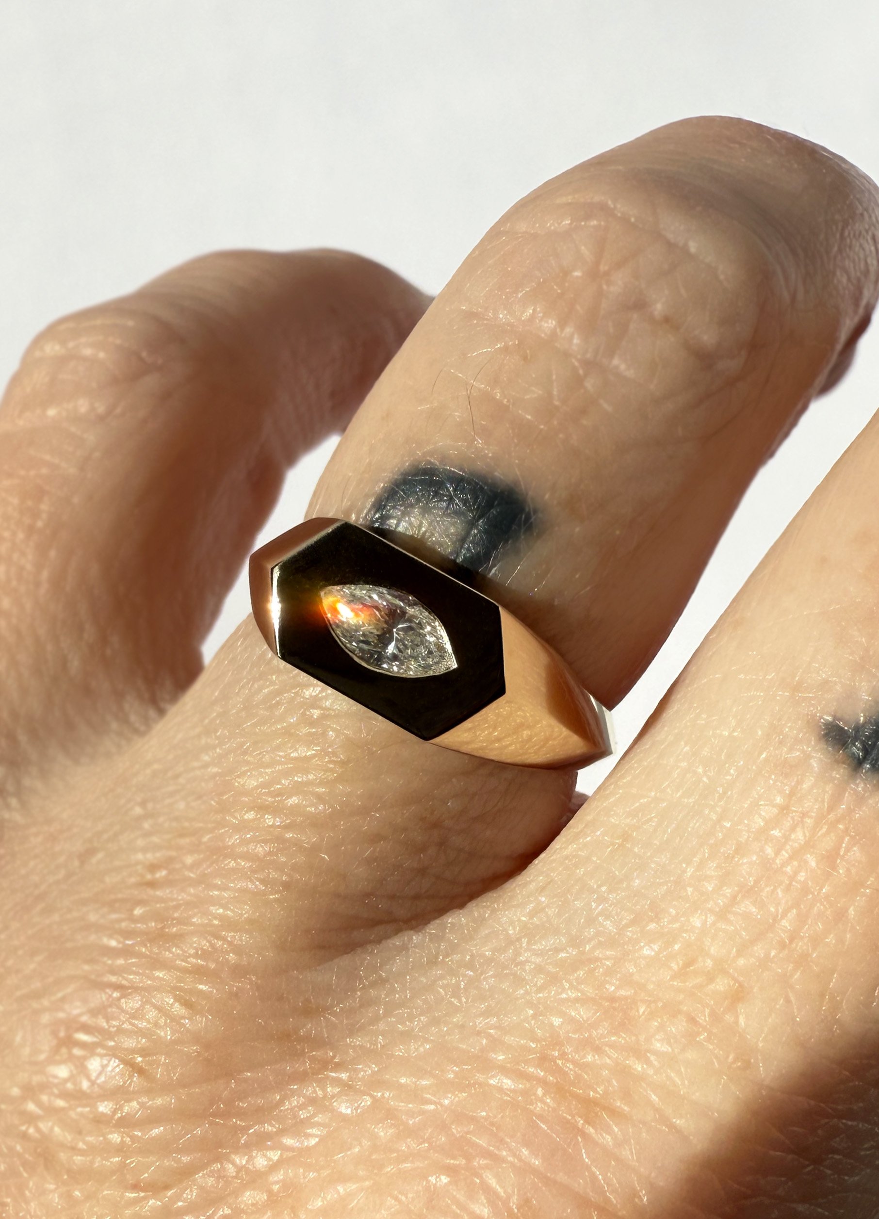 A 14k gold ring with oval shaped heirloom diamond.