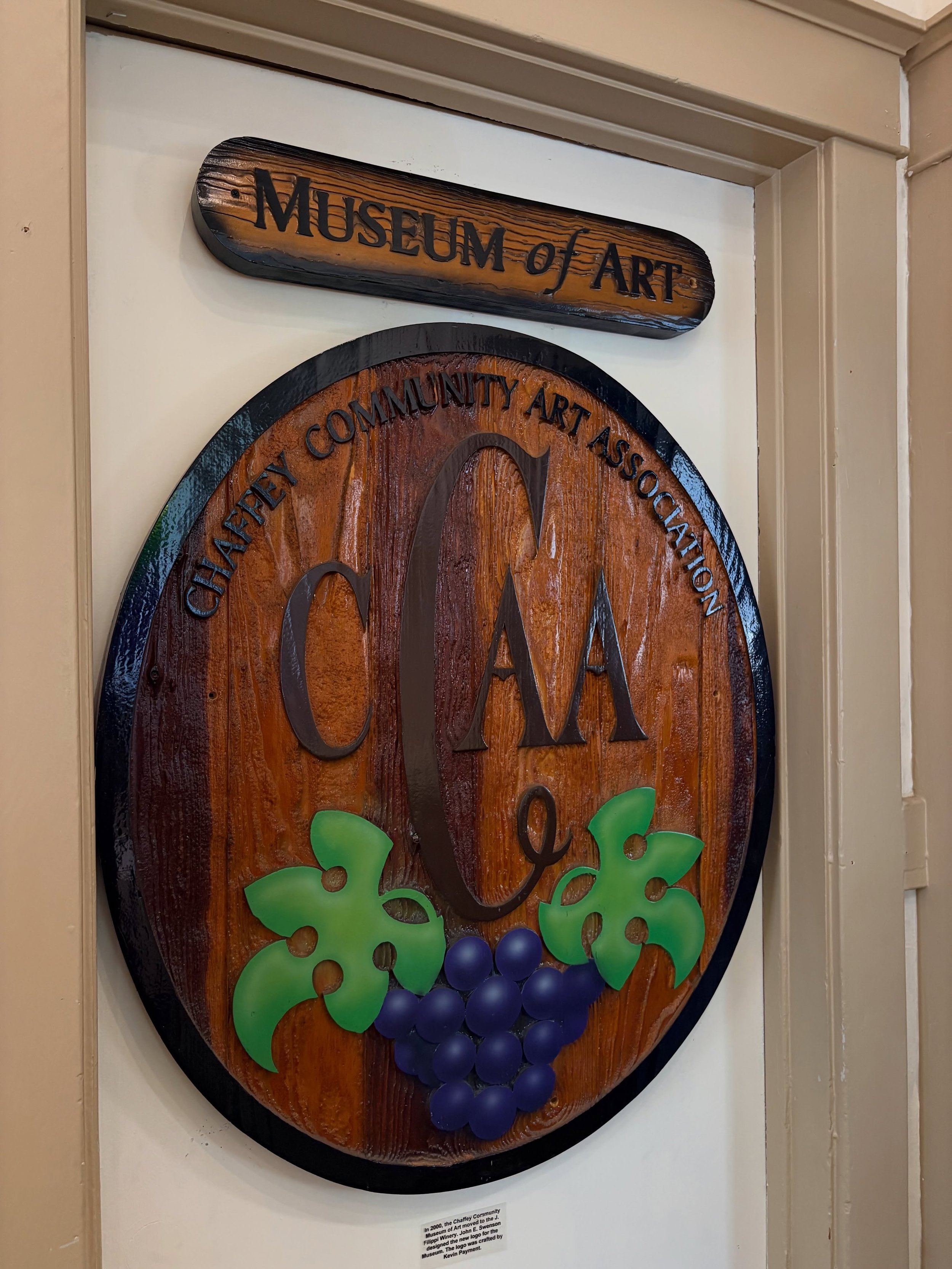 Oh what history lies within CCMA

Although we now reside in our beautiful location, this plaque showcases our rich history. Made in 2000 by John Edward Svenson, this wood centerpiece, became the new logo for the then, Chaffey Community Art Associatio