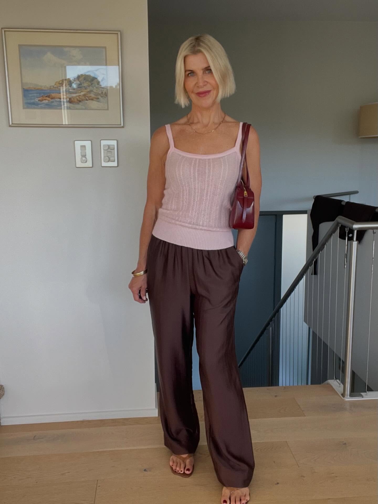 Chocolate + pink is one of the easiest ways to look modern right now.

It&rsquo;s not a going out outfit.
It&rsquo;s how it&rsquo;s its out together.

Silky chocolate pants
Soft pink knit 
Deep red bag

Nothing complicated, but the mix of tones does 