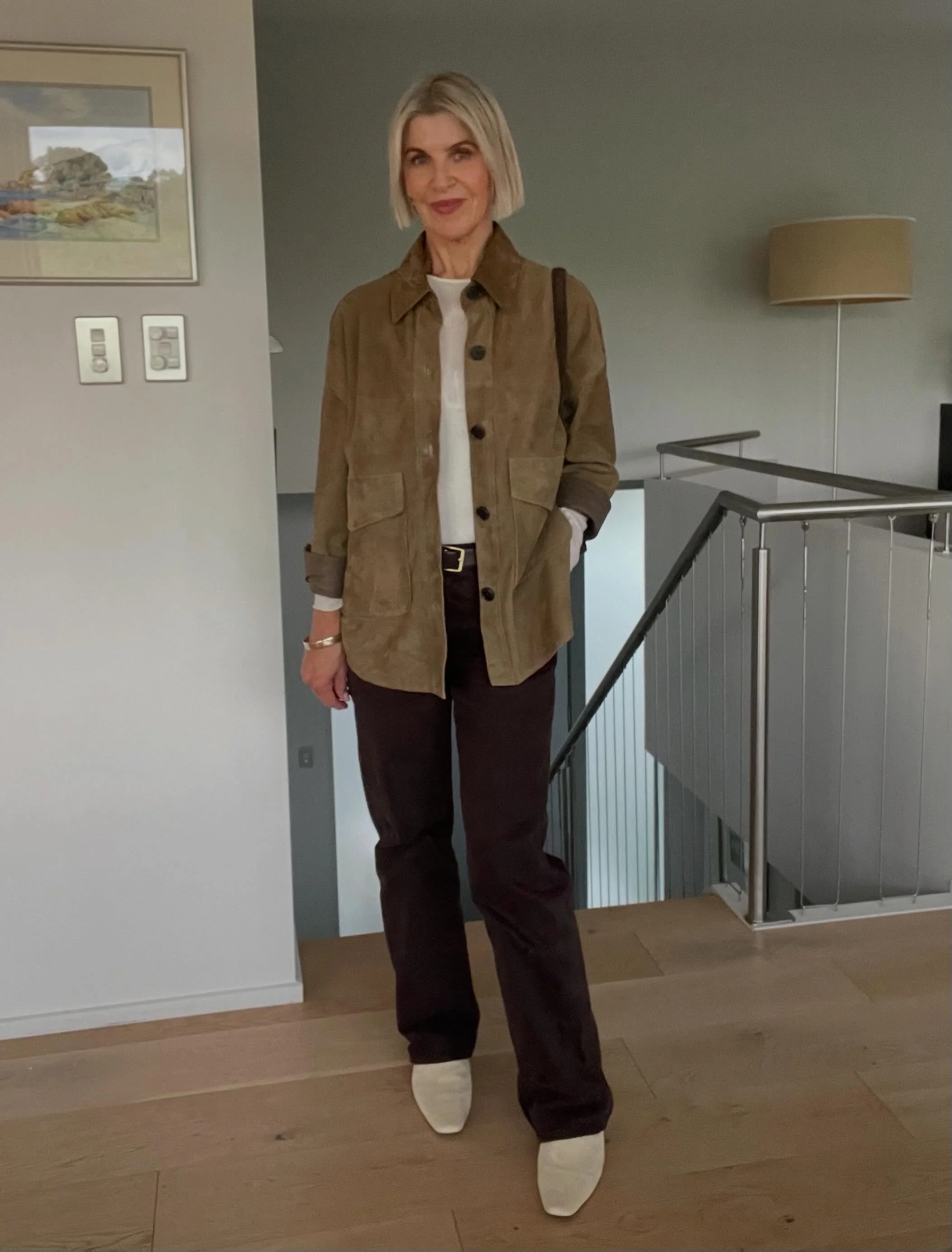 Chocolate jeans, olive suede shacket, creamy tee, off-white shoes, chocolate suede bag.

Nothing matches exactly. But everything belongs together because it all comes from the same warm family of tones. 

That&rsquo;s the difference between a matchy 