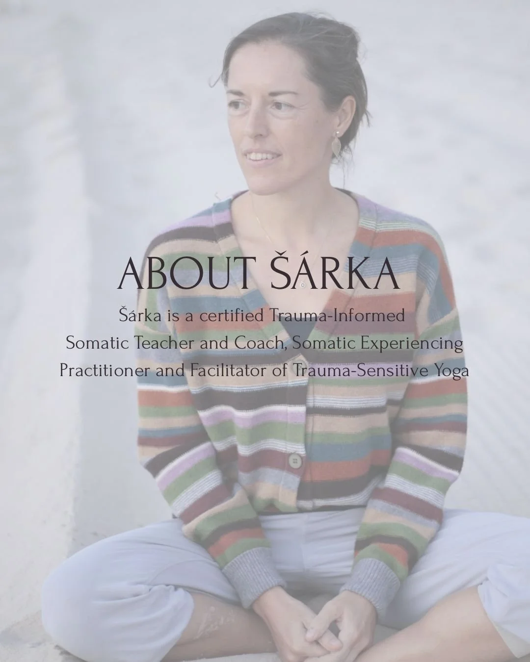A woman sitting cross-legged on a beach, wearing a multicolored striped sweater and white pants, with text overlay about Šárka, a trauma-informed somatic teacher and coach.