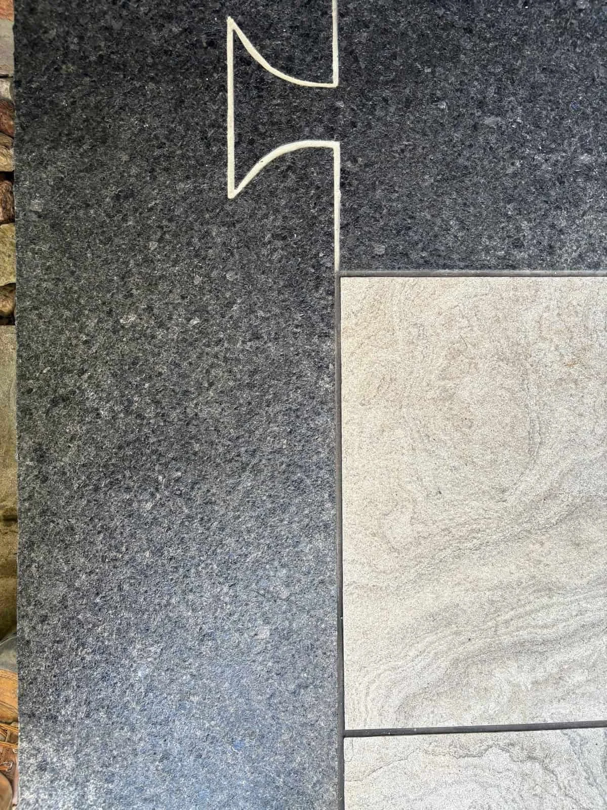 Dovetail cut into granite coping.