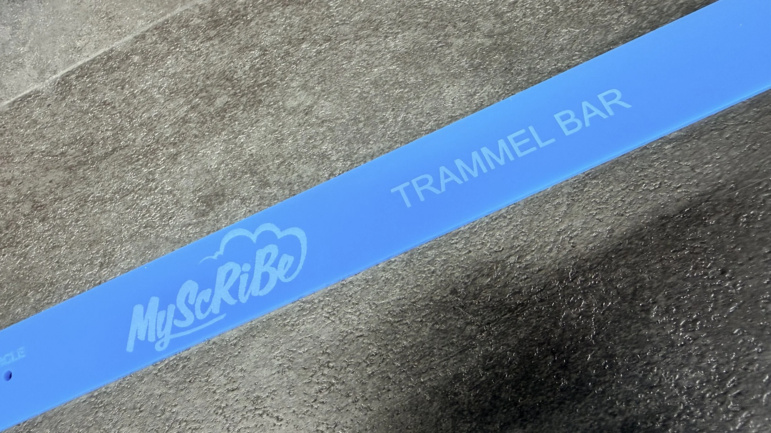 MyScribe logo and Trammel Bar name engraved into the blue Perspex flooring layout tool