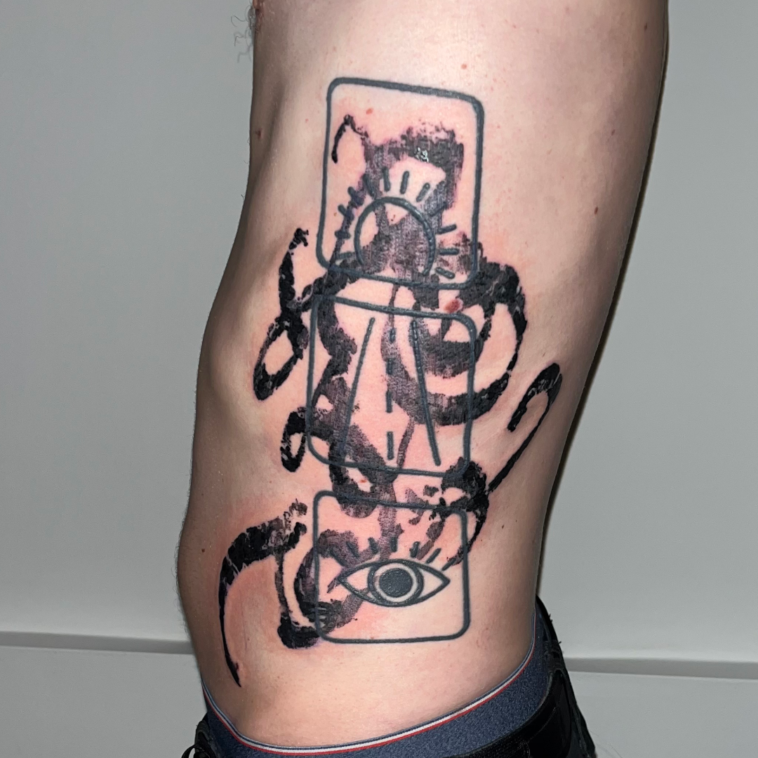 Large abstract and asemic calligraphy tattoo on ribs