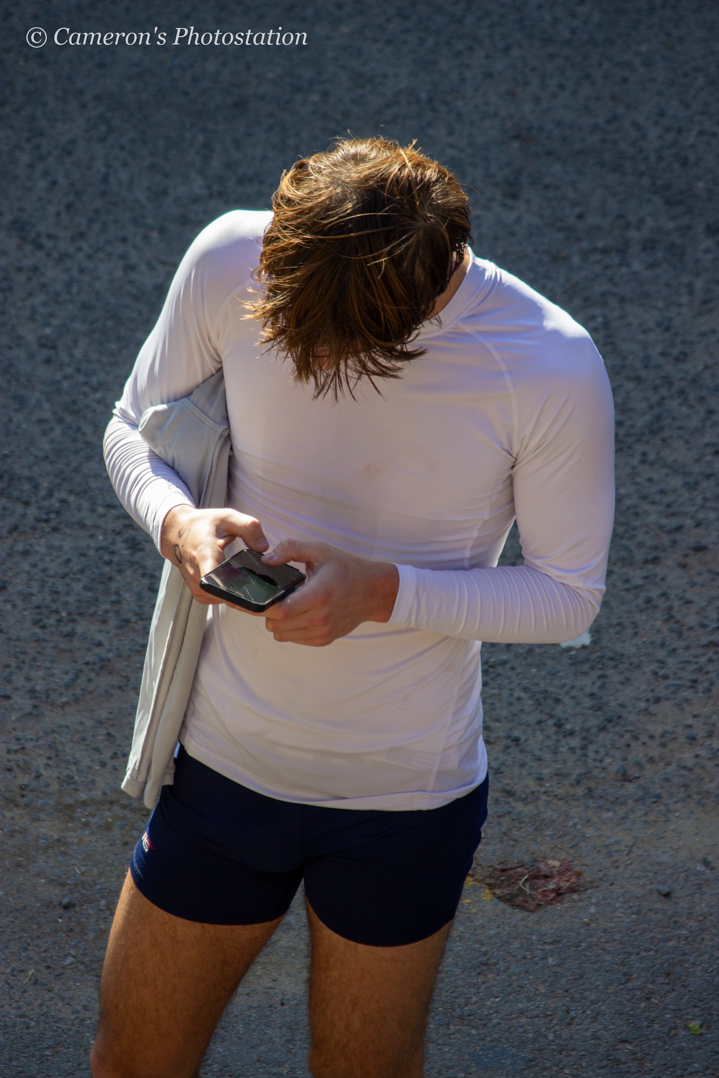 Competitor stopping the playlist on their phone.