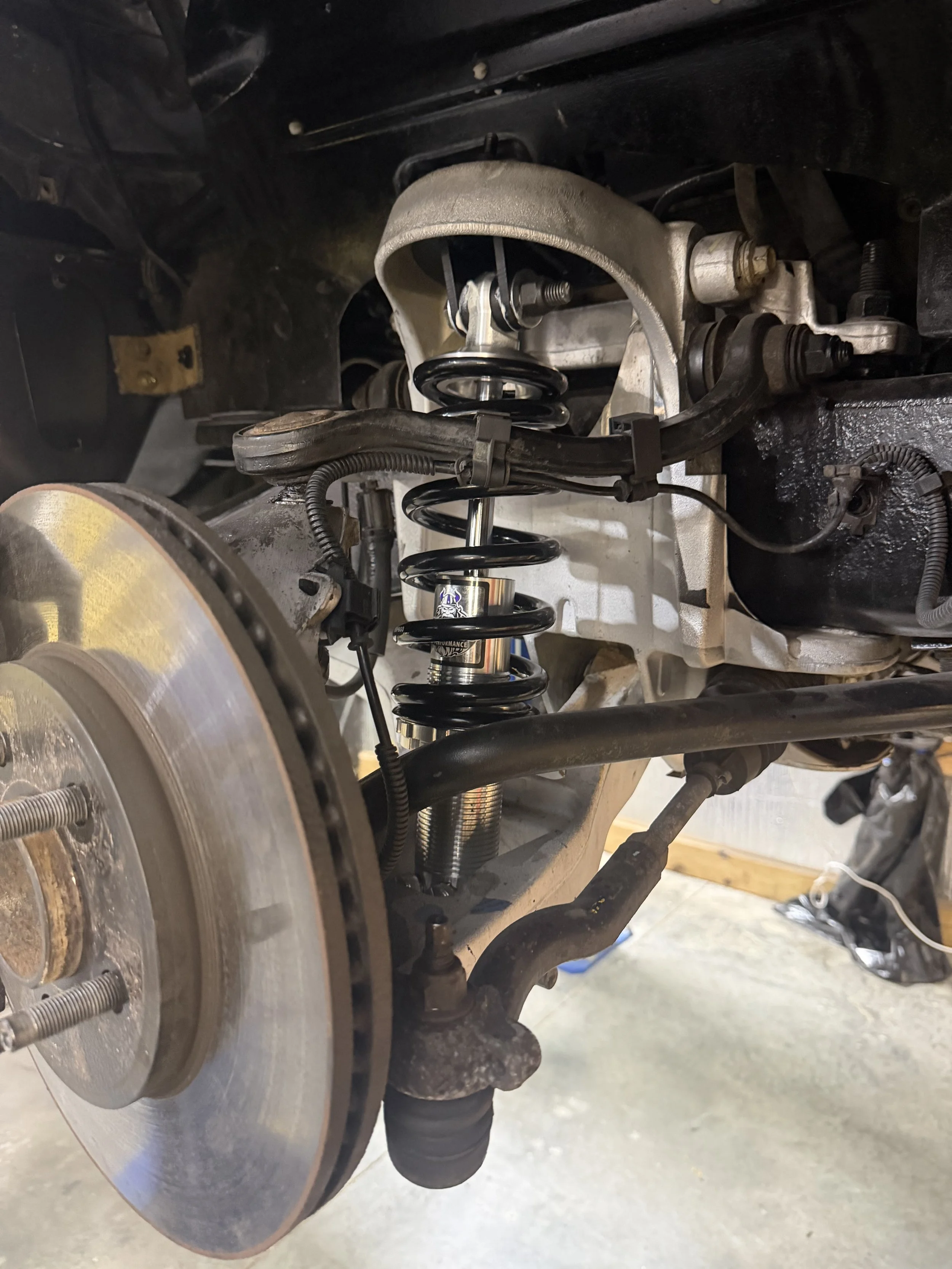 shocks under car.jpeg
