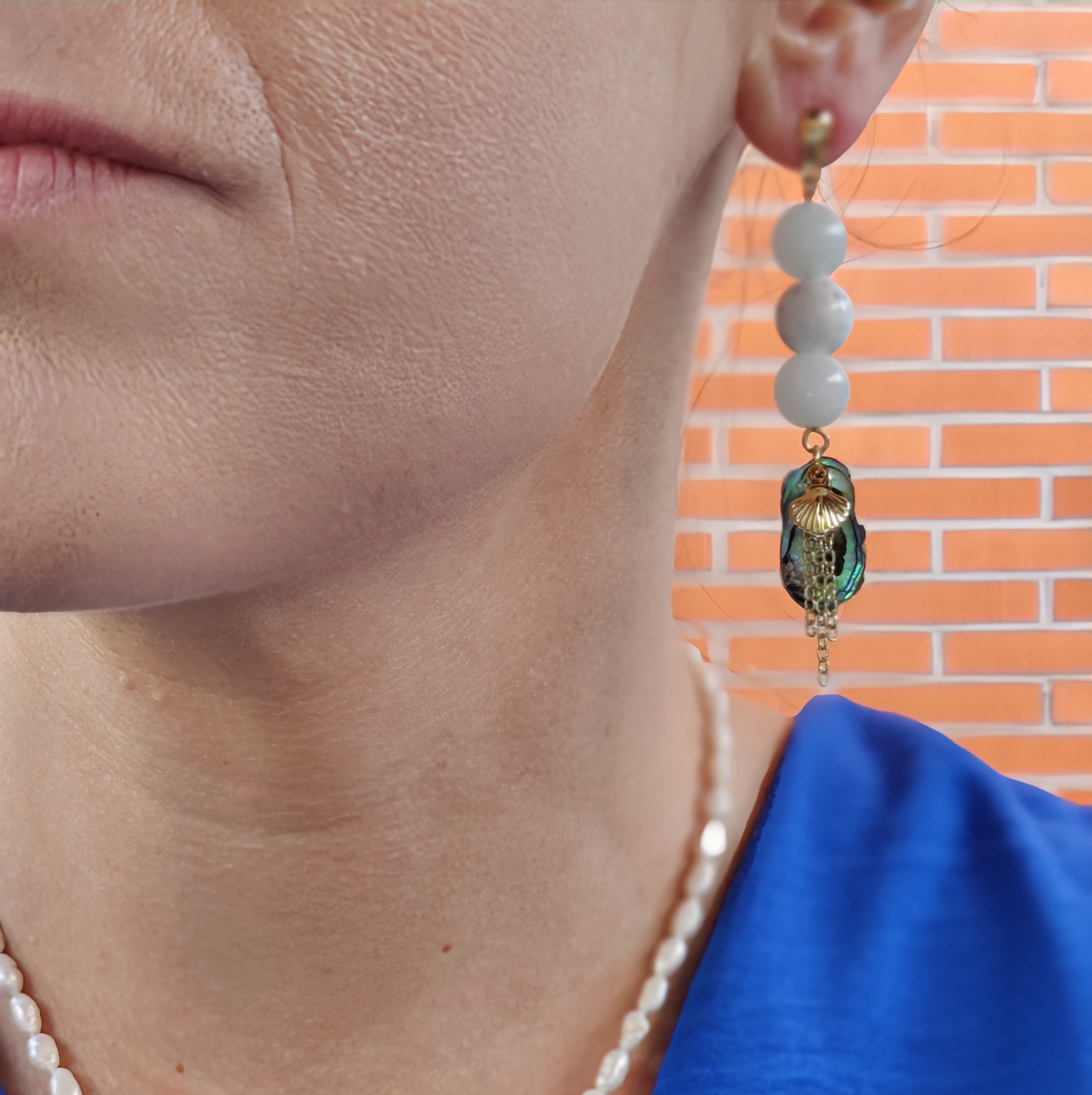 Jade and Howlite Drop Earrings on person.jpg