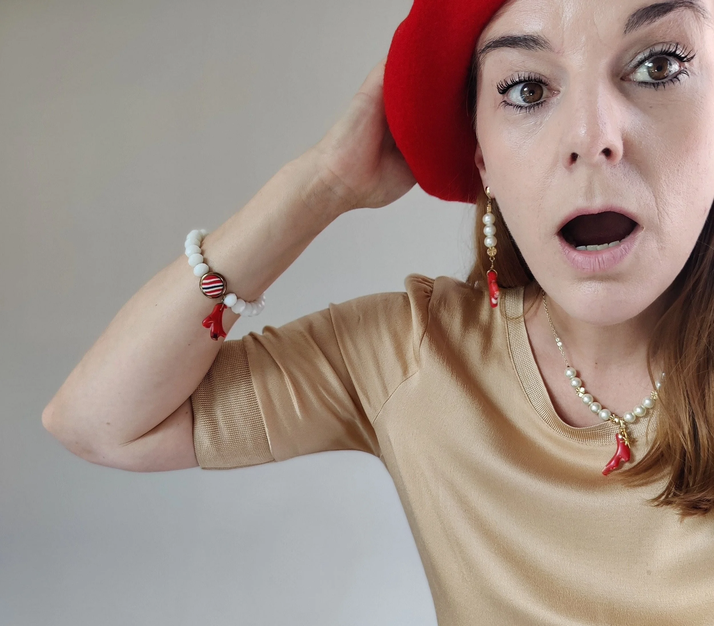 Retro Button and Red Coral Bracelet on person.jpeg