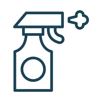 Spray bottle with a nozzle spraying cleaning solution