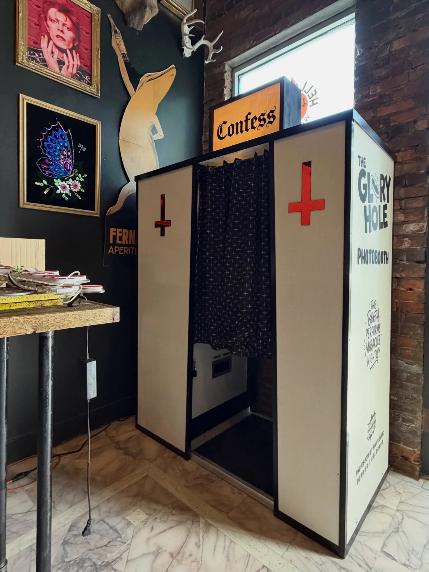 CONFESS in our latest photobooth at @thegloryholedenver at the resurrected @hellorhightiki ||| A stark confession booth (inspired by Catholic guilt) with some hidden surprises. Enter through the Glory Hole, say some Hail Marys, and get beauty filtere