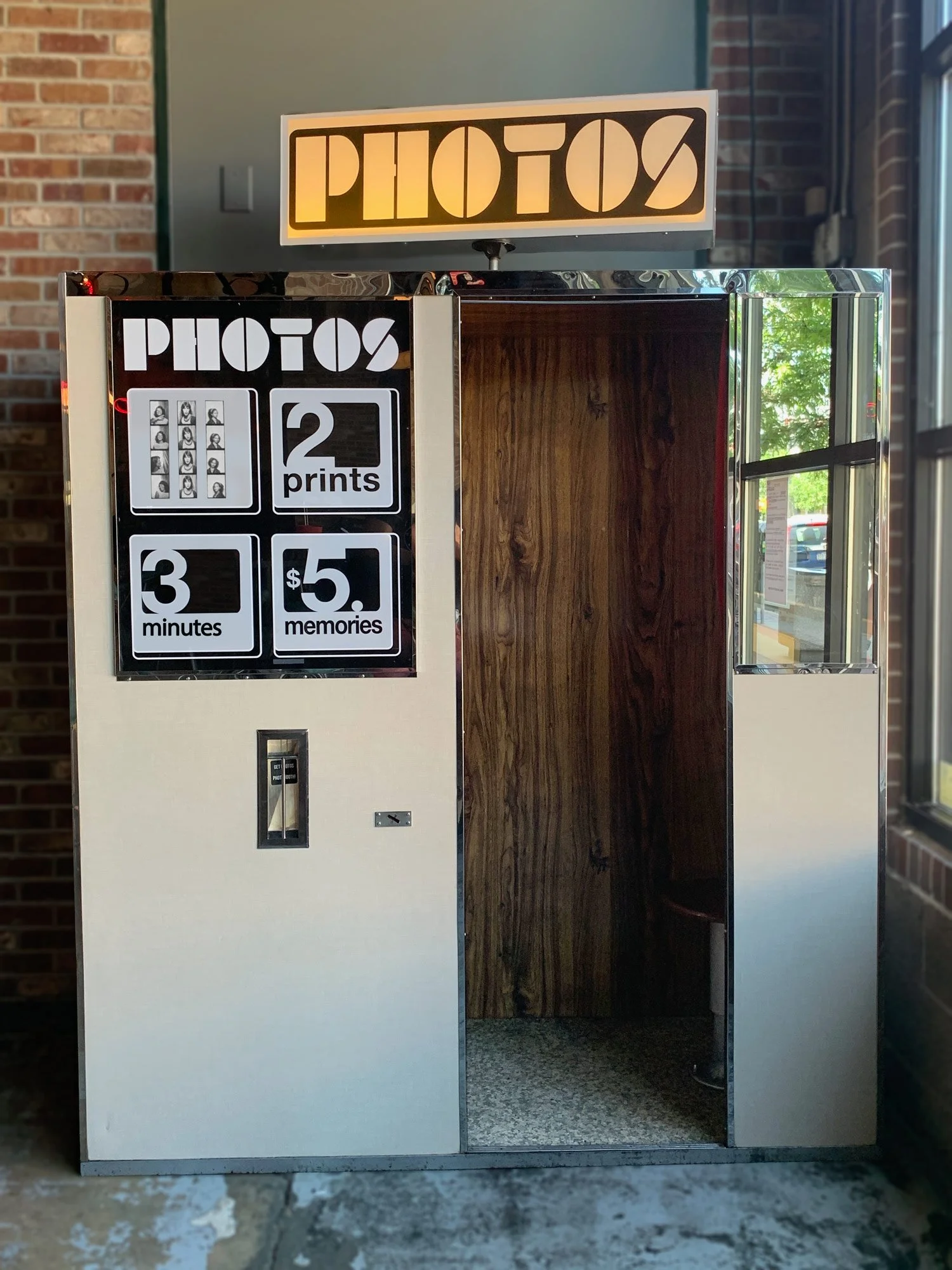 Model 17 vintage photo booth showing creamy linen exterior and wood grain interior