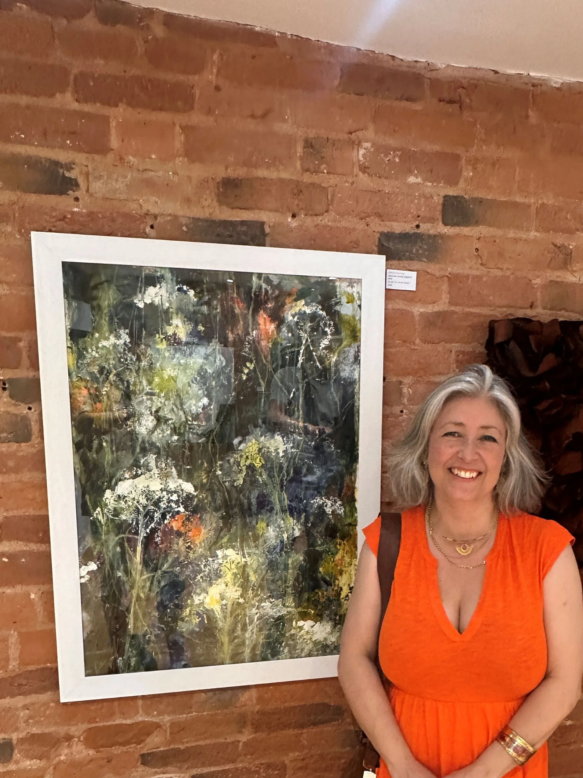 Artist Catherine Burbridge in front of her painting exhibited at The Tarpey Gallery Open 2026