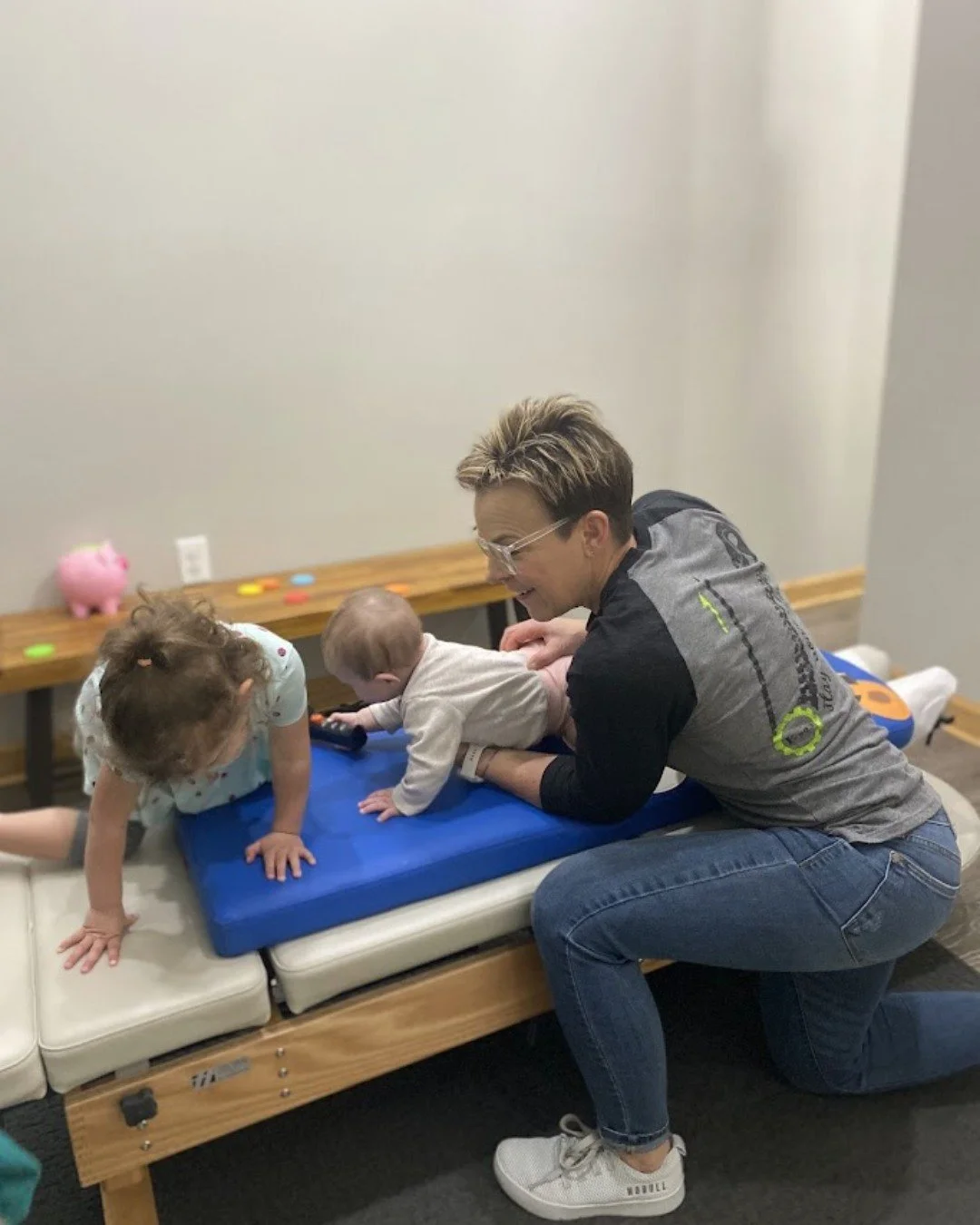 Healing looks a little different around here 💚

Sometimes it looks like milestone moments and big changes&hellip; and sometimes it looks like babies getting adjusted while siblings climb on the tables beside them 😂🫶

That&rsquo;s the beauty of neu