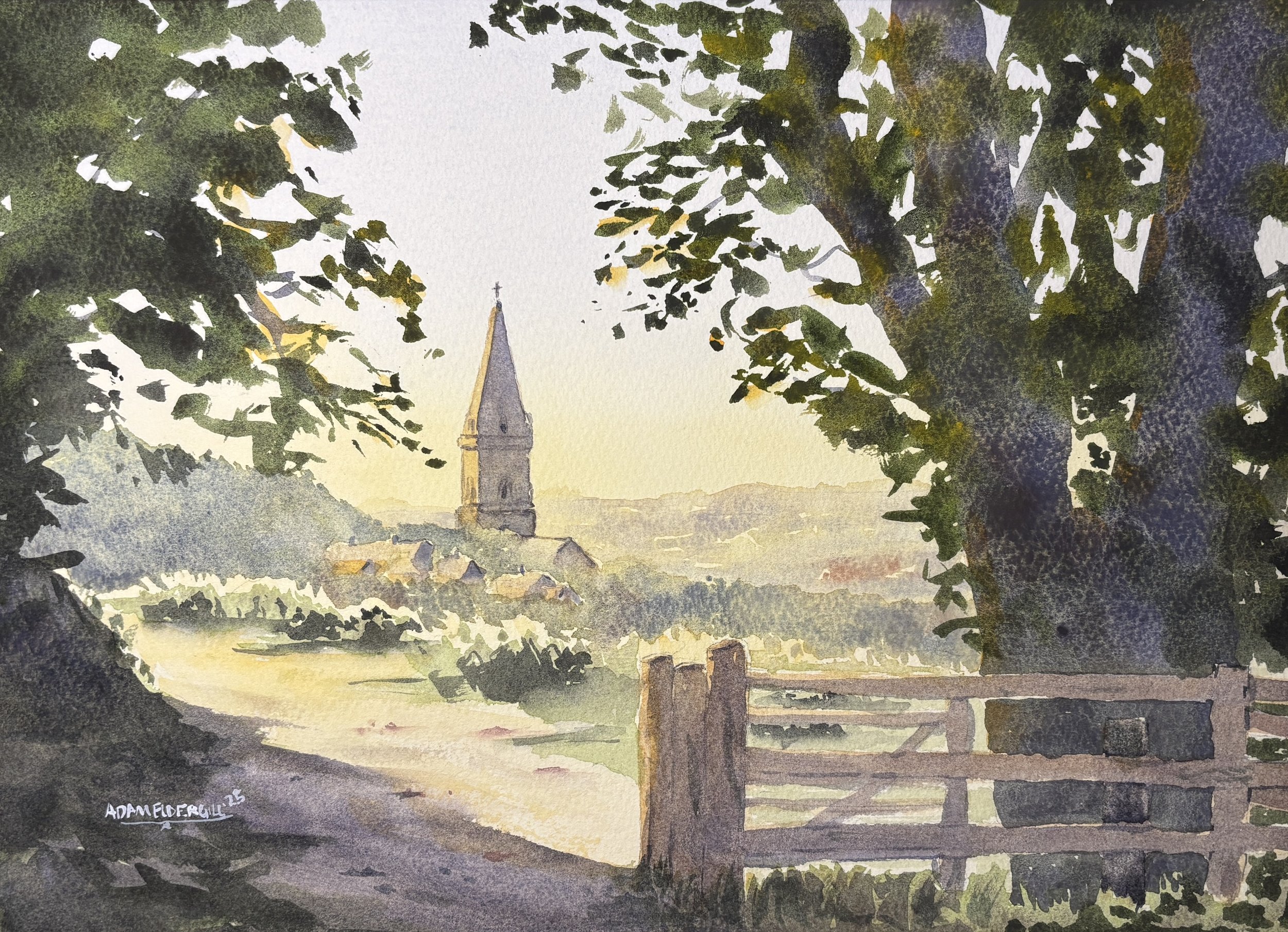 A soft-focus landscape watercolour painting by Adam Eldergill, featuring a stone church spire rising above a misty English village at sunrise. Golden light washes over a rustic wooden gate in the foreground